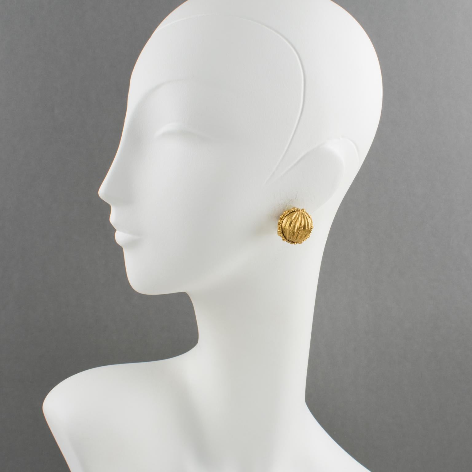 Lovely couture clip-on earrings designed by Gianfranco Ferre, made in Italy. Sphere design with gilt metal all carved and textured. Signed underside: 