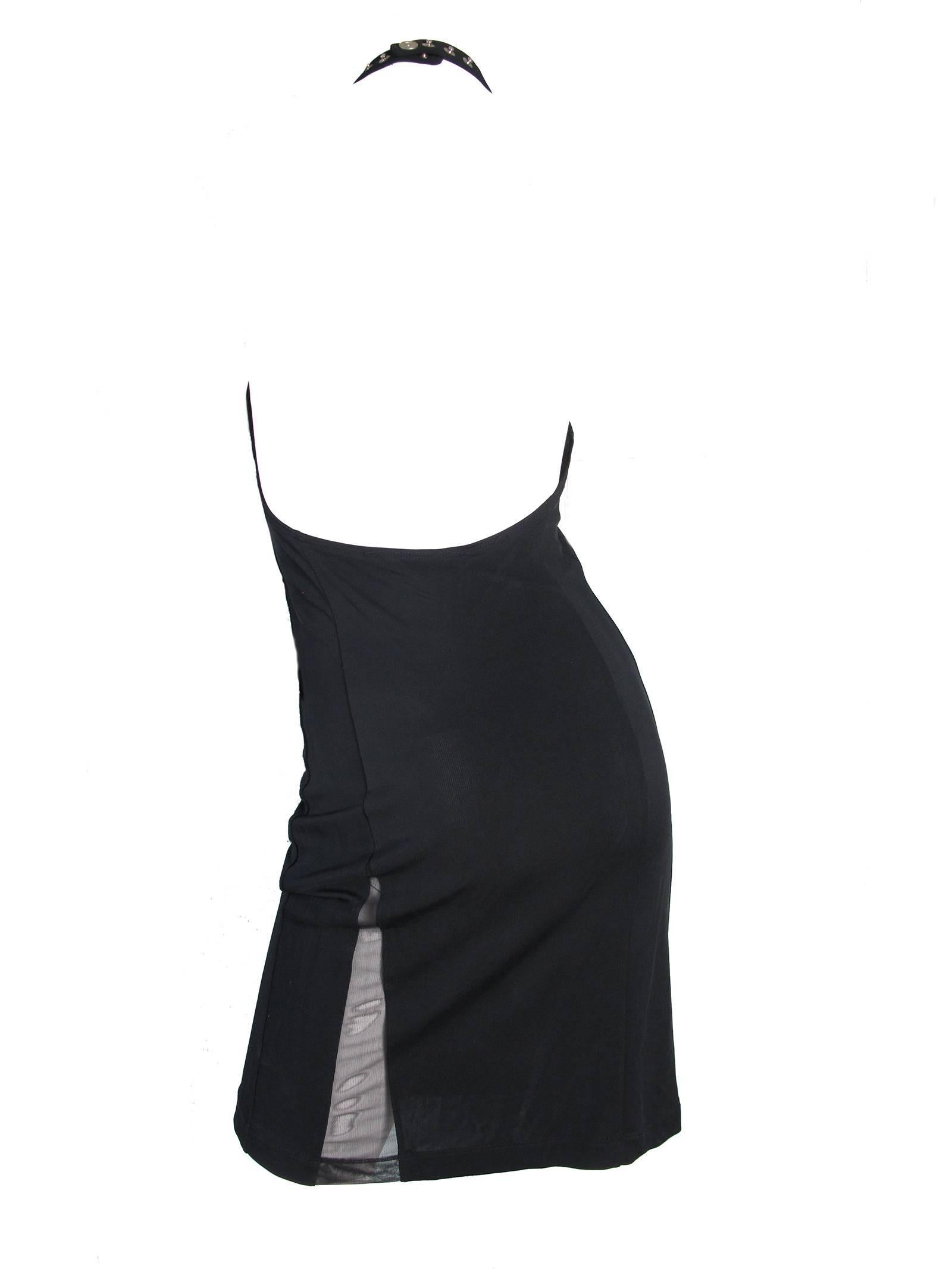 Gianfranco Ferre black hatler dress with mesh slit on front and back.  Snaps to close. Condition: Very good.  Size 40

We accept returns for refund, please see our terms.  We offer free ground shipping within the US.  Please let us know if you have