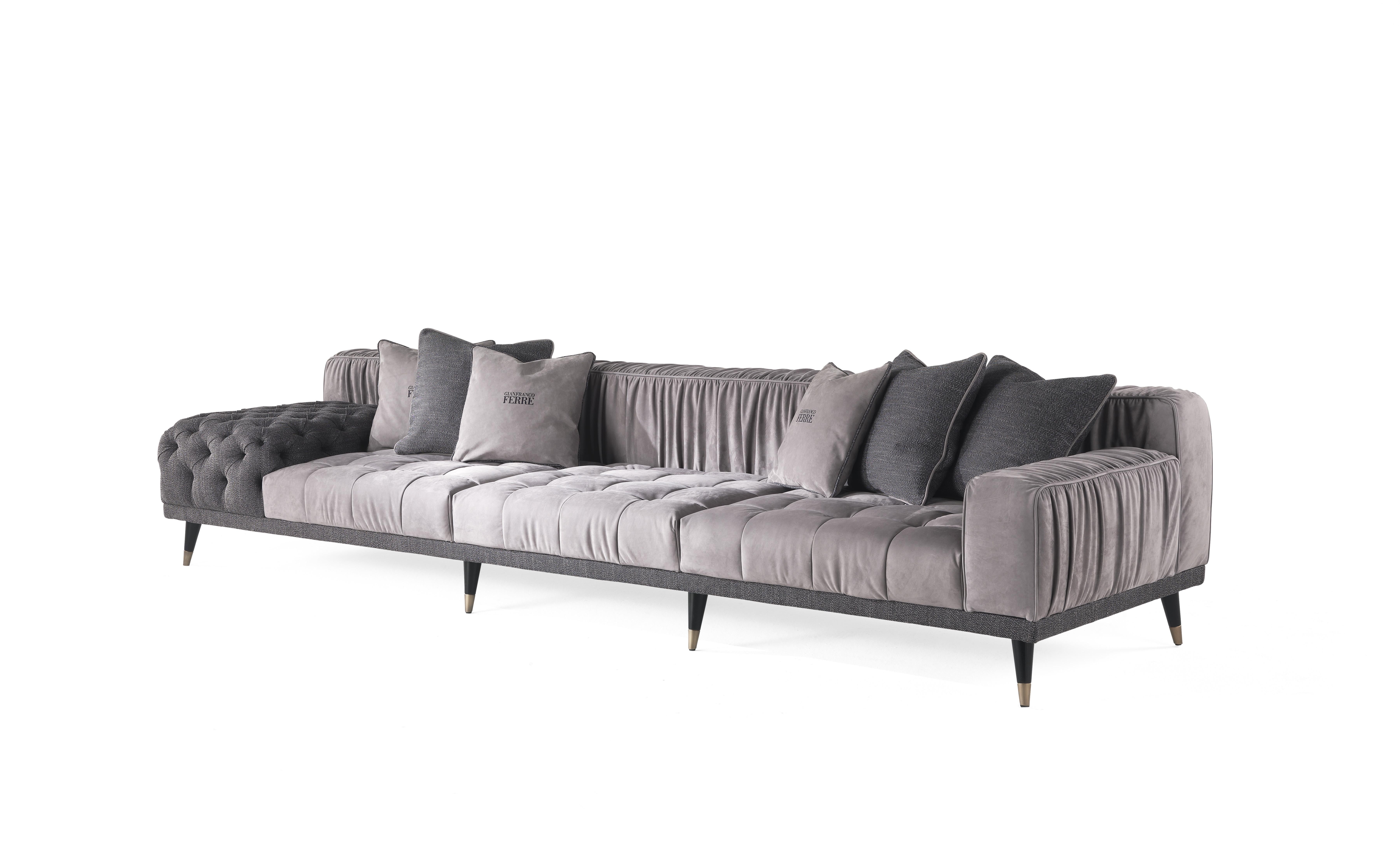 A sofa with a bold personality that combines essential design, contemporary lines and a high level of craftsmanship. The alternation between different finishings, with capitonné parts and pleating on the back creates a unique and refined set that