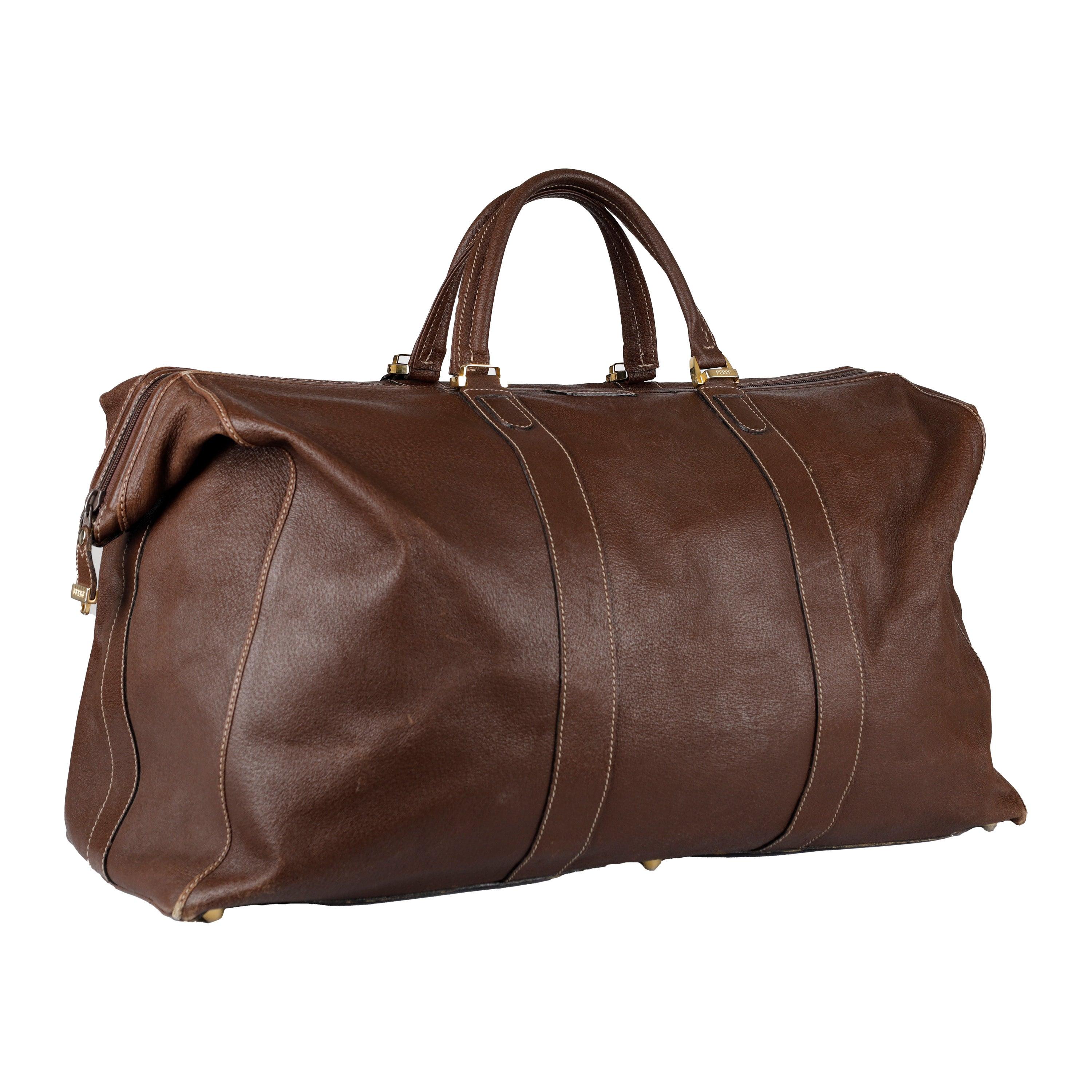 The Gianfranco Ferré large travel bag is the perfect luxurious accessory for any globetrotter. Crafted from brown calfskin, it features a secure zip closure and golden hardware. The signature logo is expertly carved onto the leather, and studs on