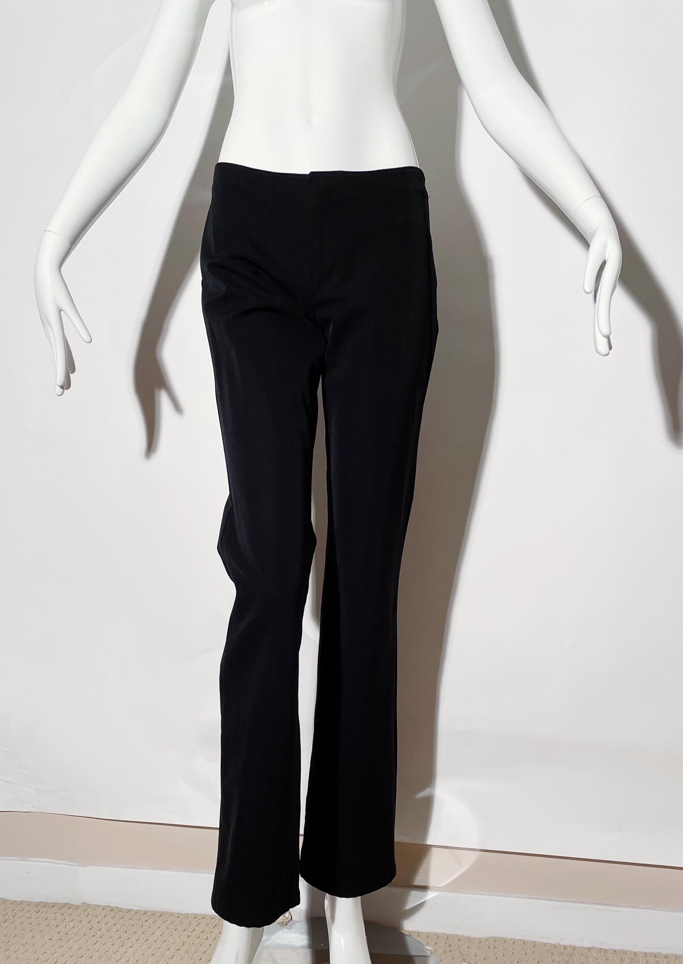 Black low rise pants. Front zipper closure. Rear pockets. Flare bootcut. Nylon and polyester. Made in Italy. 
*Condition: excellent vintage condition. No visible flaws.

Measurements Taken Laying Flat (inches)—
Waist: 26 in.
Hip: 30 in.
Rise: 8