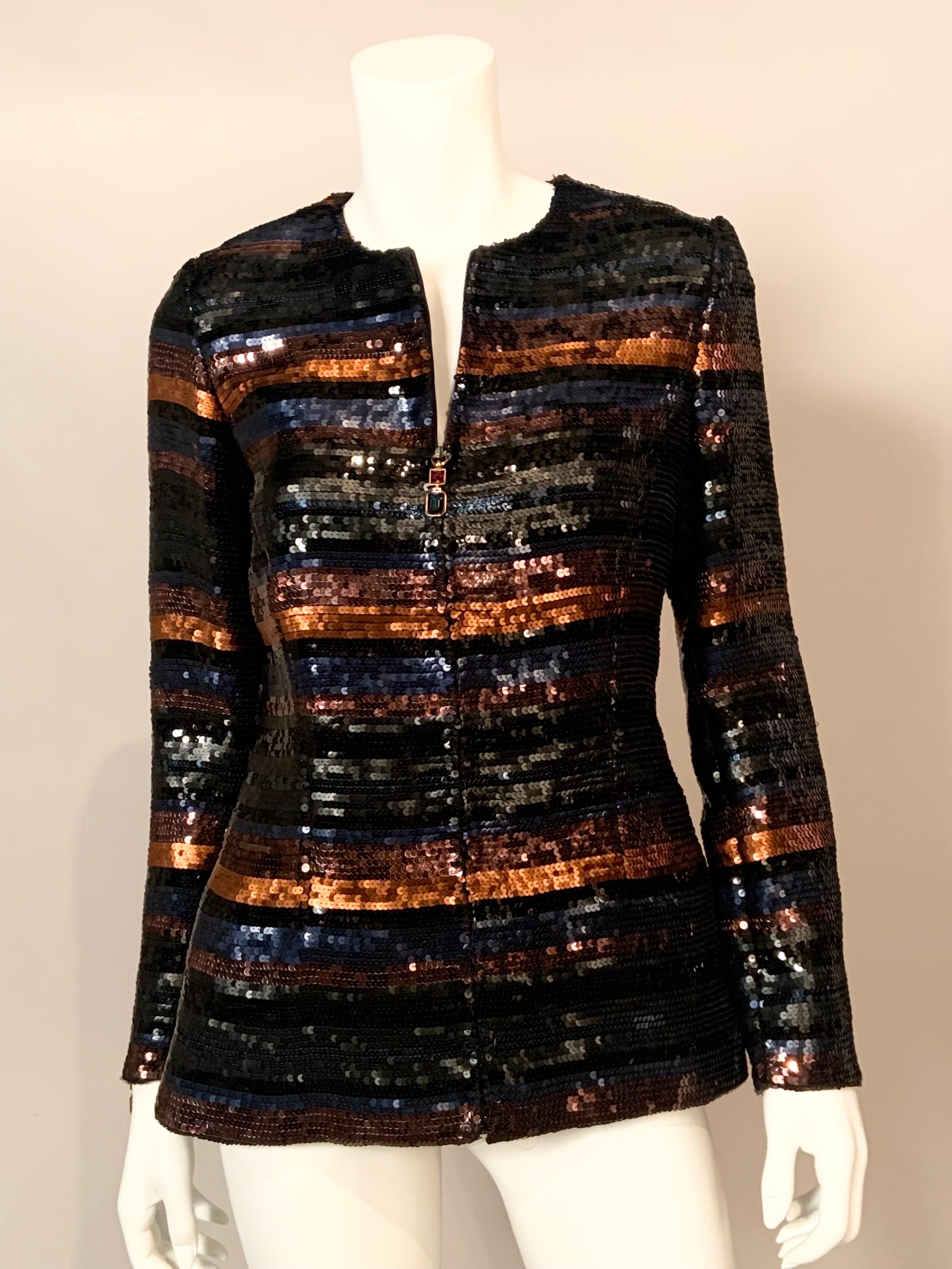 This zip front sequin jacket from Gianfranco Ferre is not only beautiful but it is quite versatile as well.  The multi color sequins allow you to pair it with many different pieces in to create a variety of looks.  The jacket is composed of shiny