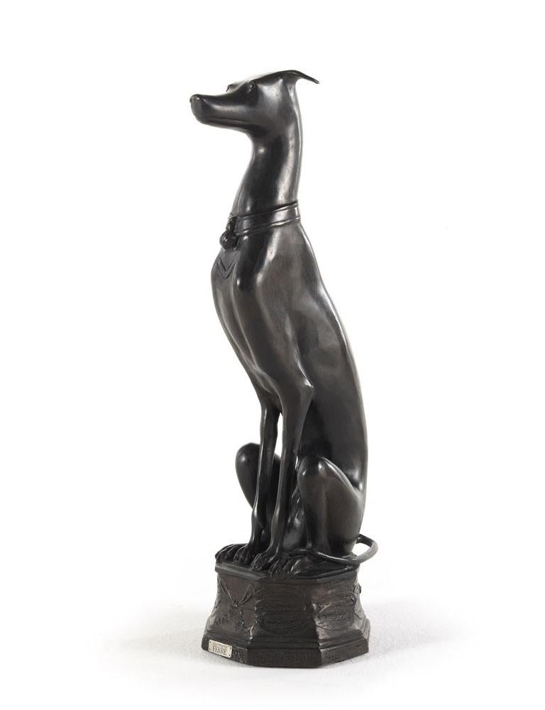 Black bronze dog sculpture. A playful decorative element for any home, especially perfect for a living room or entryway space.