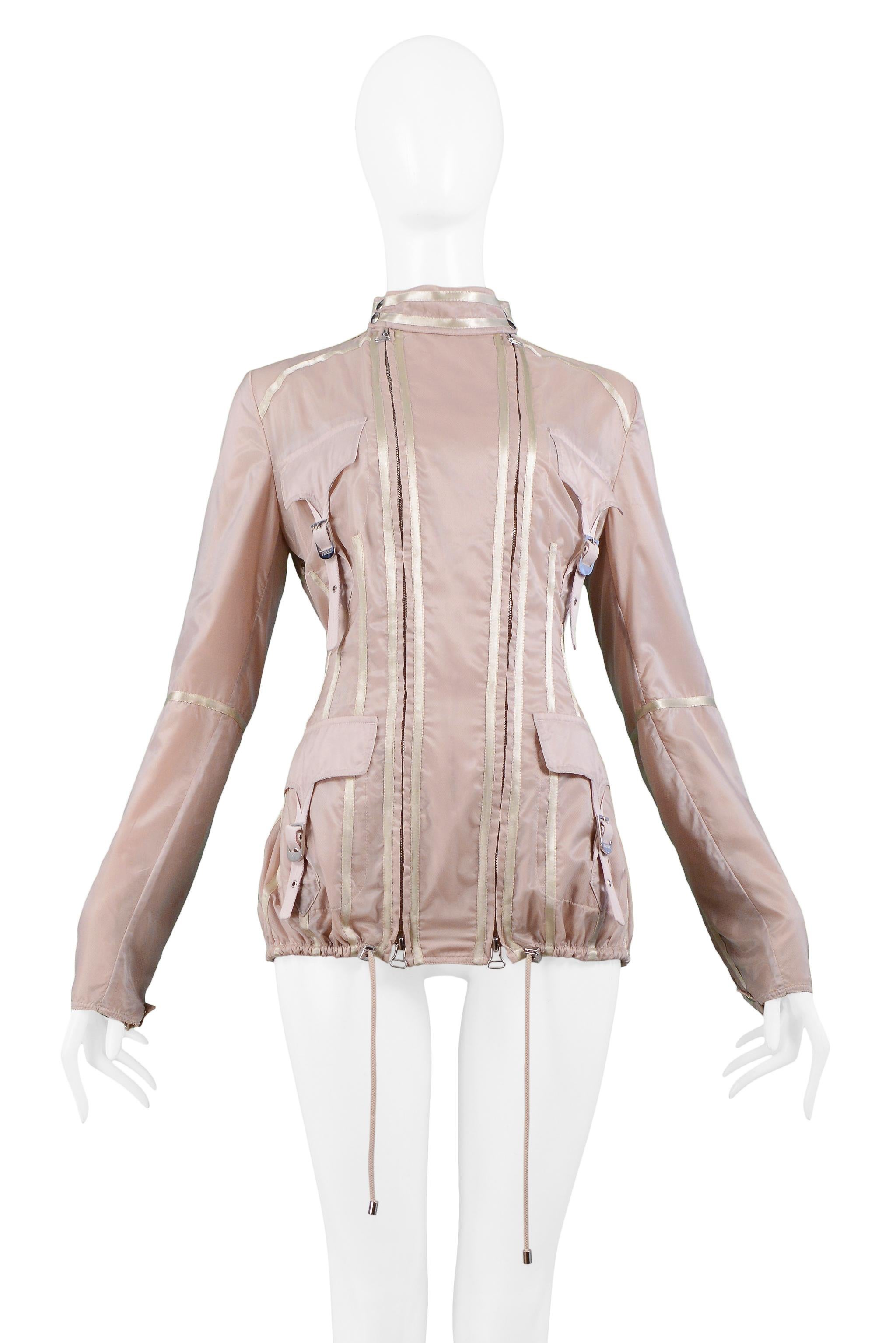 Resurrection Vintage is excited to offer a vintage Gianfranco Ferre blush pink nylon windbreaker jacket featuring double zippers at front, four flap pockets with buckle closures, zippers at sleeves with inset mesh panels, and drawstring at hem.