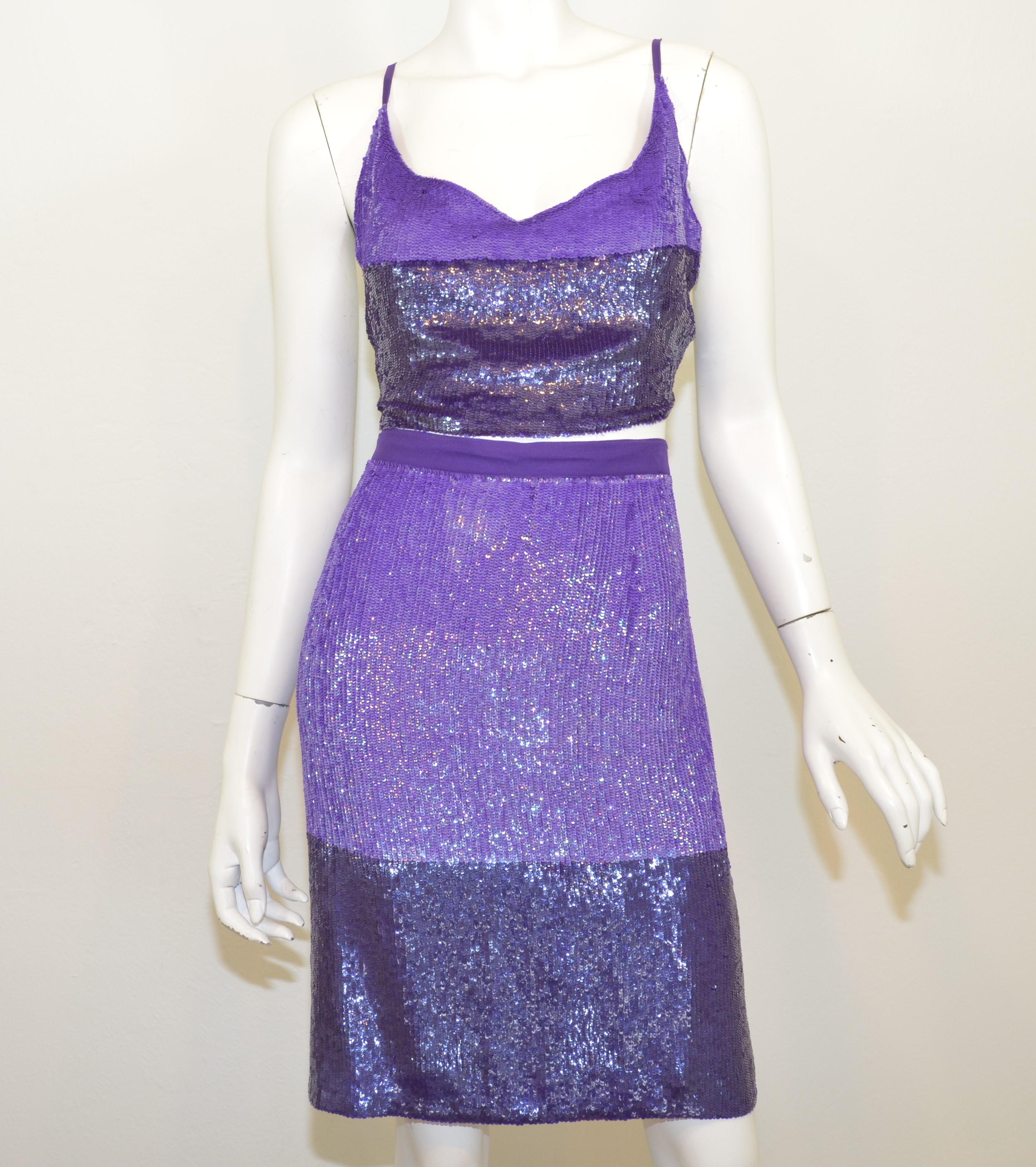 Gianfranco Ferre skirt set is featured in purple and fully-embellished in sequins. Skirt has a back zipper and hook-and-eye fastening at the back. Top has an open back with a tie closure and can be adjustable.

Measurements:

Top - 22'' (back