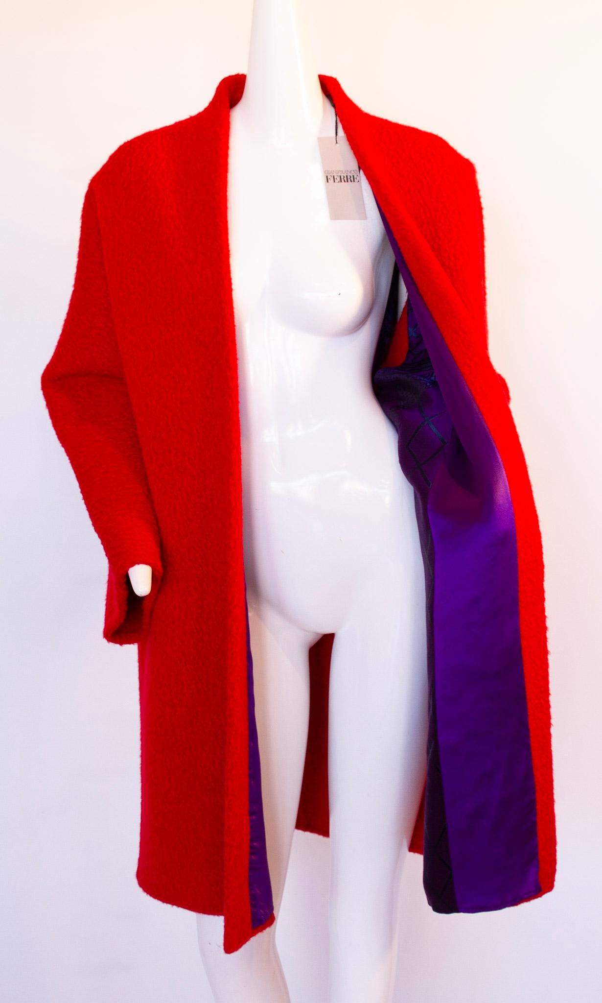 Gianfranco Ferre, Circa 1978
Oversized, Red, Cocoon Coat
70% Wool, 30% Alpaca
Interior Purple Design Lining
Hidden Side Pockets
Architectural and Minimalist Design
NWT
Made in Italy
Size IT40