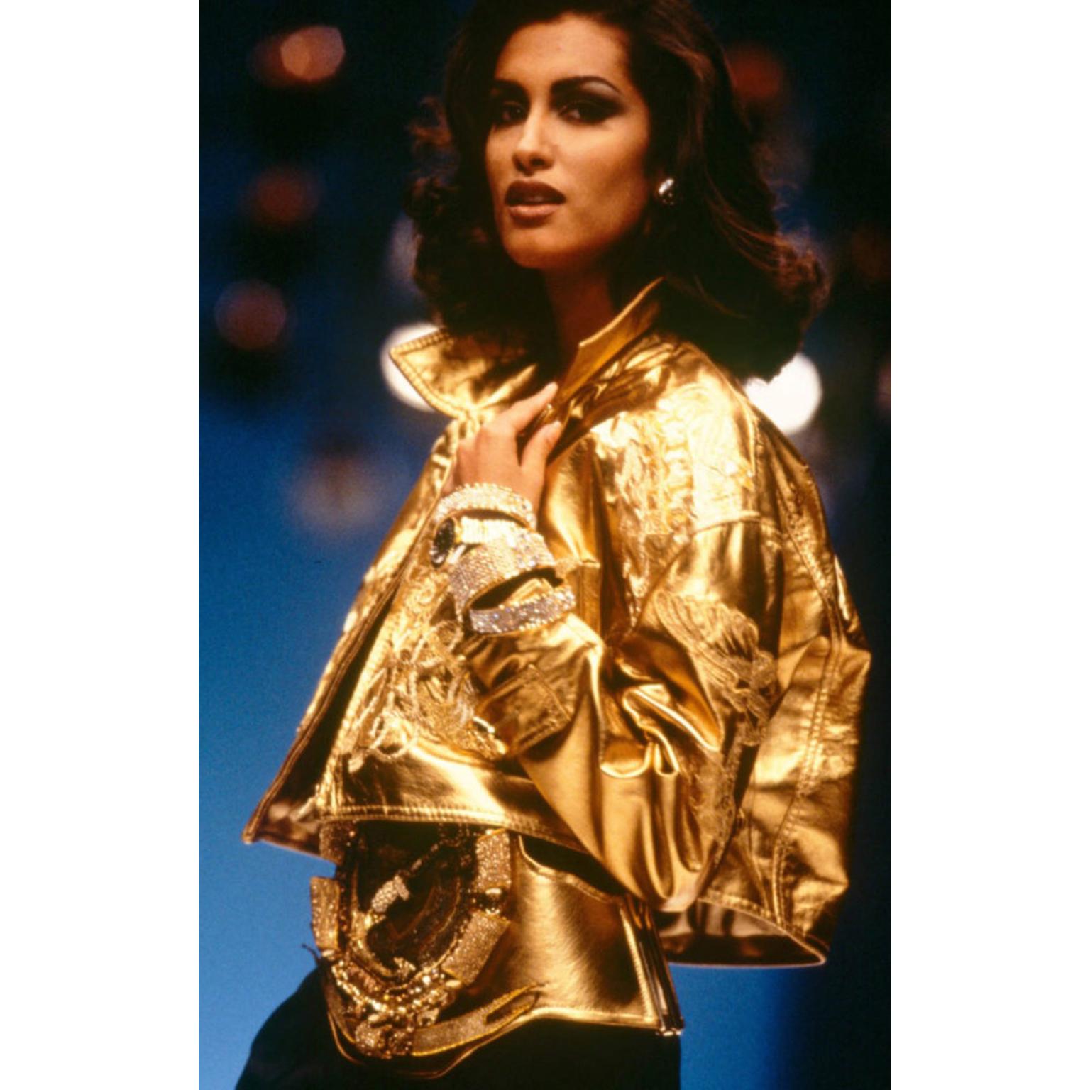 This vintage Gianfranco Ferre gold leather jacket is out of this world and appears to have never been worn! This fabulous documented jacket was featured on the Spring Summer 1992 runway as worn by Yasmeen Ghauri. Beautifully embroidered with