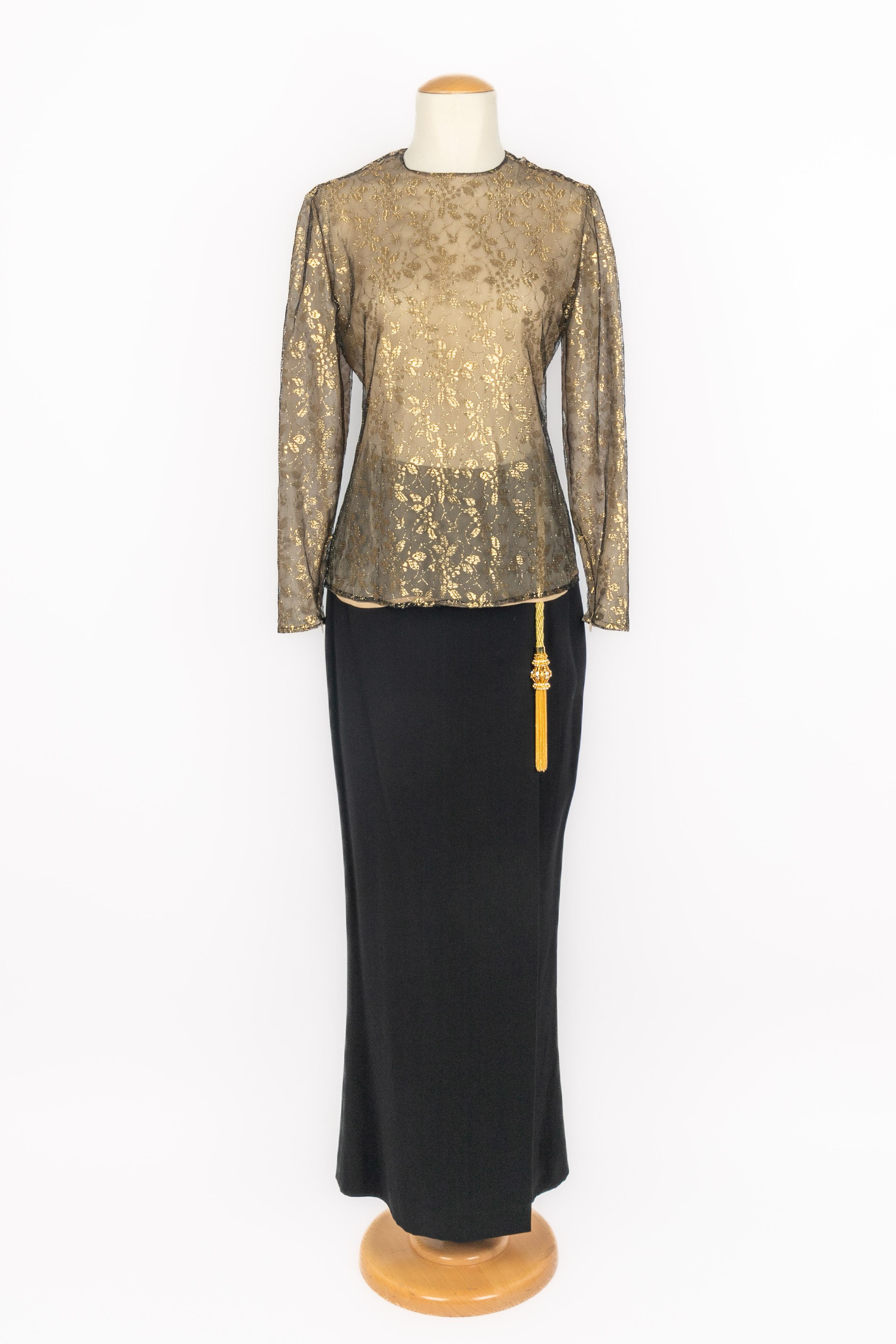 GIANFRANCO FERRÉ - (Made in Italy) Set composed of a black fishnet top with golden embroidery, and a long black skirt decorated with golden trimmings and a golden metal pompom. Size 38FR/40IT indicated, it fits a 34FR/36FR. A Collection circa