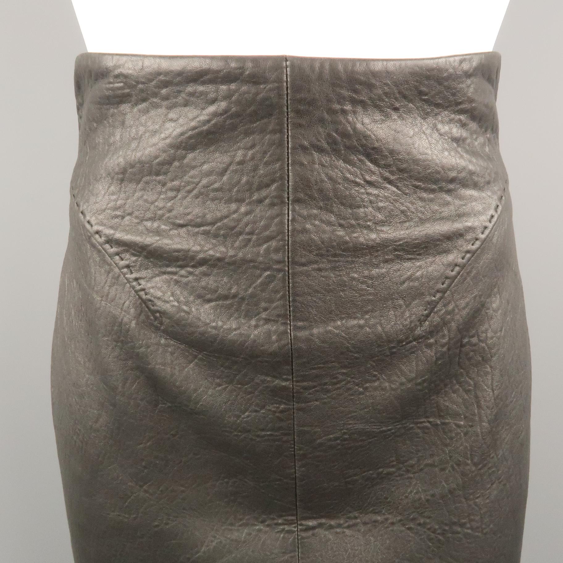 Vintage GIANFRANCO FERRE pencil skirt comes in soft black textured leather with a high rise, darted front, and back cutout with belted waist. Made in Italy.
 
Excellent Pre-Owned Condition.
Marked: IT 40
 
Measurements:
 
Waist: 25 in.
Hip: 36