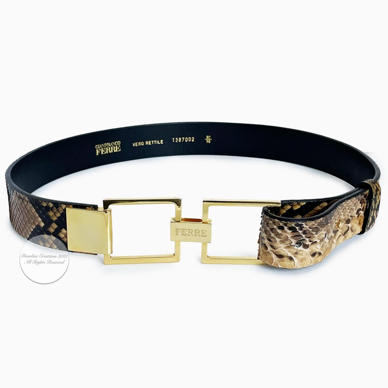 Preowned, vintage snakeskin belt by Gianfranco Ferre, likely made in the 90s.  Genuine snakeskin, leather backing.  It fastens by wrapping the strap around the geometric gold metal buckle and post.  A lovely and unique way to accessorize your look. 