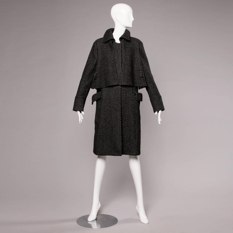 Unbelievably soft gray wool and alpaca blend coat with a cape detail by Gianfranco Ferre. Partially lined. 85% pure virgin wool 15% alpaca. Made in Italy. Marked size 44. Estimated size medium. Front pockets. Front hidden button closure. Matching