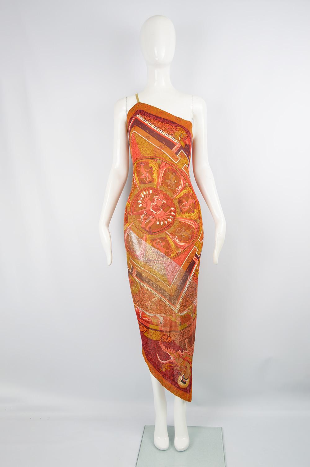 A fabulous asymmetrical vintage party / evening dress by Gianfranco Ferre for his Spring 1994 collection in an orange silk with a gold lurex and mythical Asian print 

Size: Marked IT 42 which is roughly a UK 10/ US 6/ EU 38. Please check