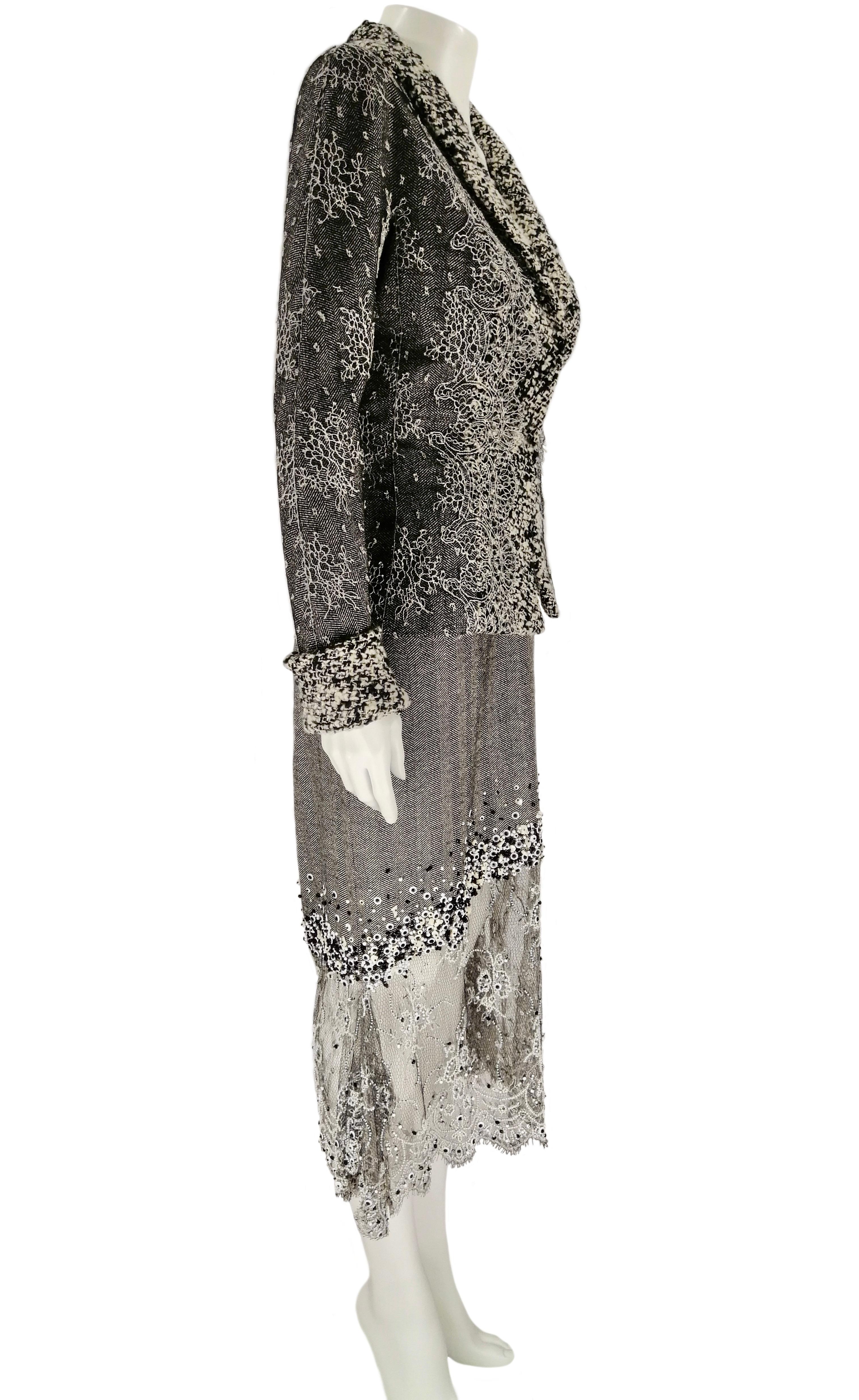 GIANFRANCO FERRÉ suit jacket and dress
Important  cocktail suit in black and white fish thorn wool fabric  with chantilly gray lace inlays embroidered in some areas with beads, mother of pearls, jas and rhinestones.
Size IT 42
Made in