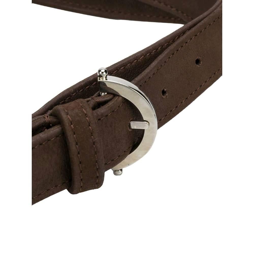 Gianfranco Ferré brown leather 2000s thin belt with silver-tone metal maxi logoed buckle.

Measurements
Lenght: 130 cm
Width: 2 cm

Product code: A6483

Notes: The buckle shows some slight imperfections, as shown in the photos.

Composition: Leather