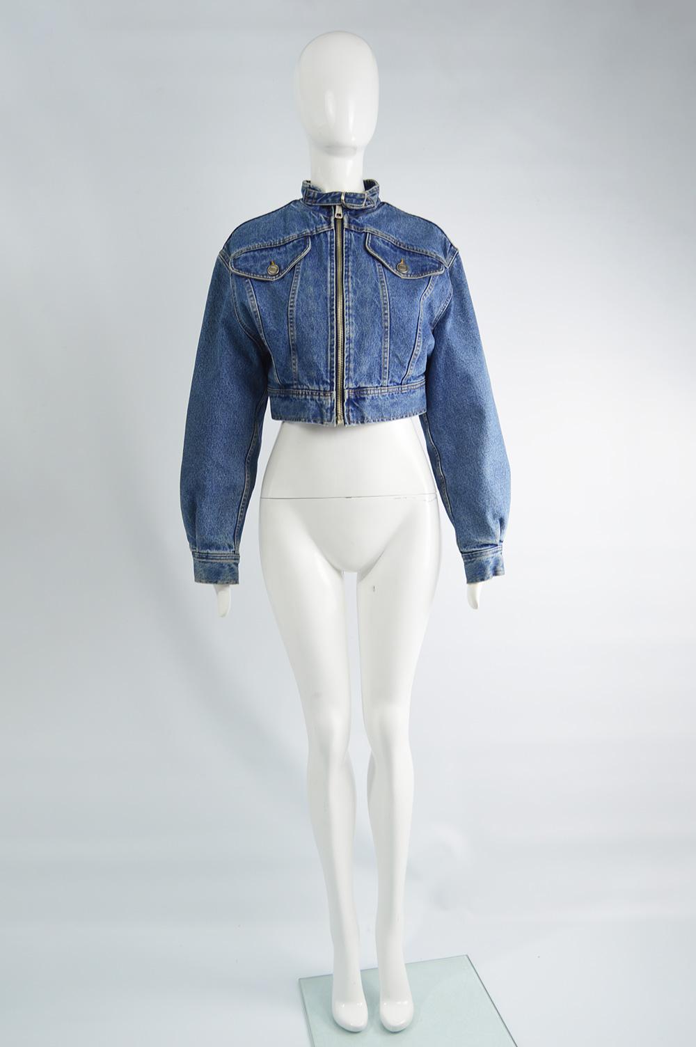 A stylish vintage women's cropped denim jacket from the 90s by Gianfranco Ferre. In a blue denim with a cafe racer style neckline, bold patches on the back and an incredible silver and blue lamé lining. 

Size: Marked EU 40 which is roughly a UK 12/