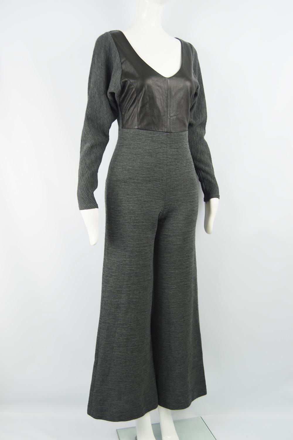 An incredible vintage Gianfranco Ferre wide leg jumpsuit from the 90s. Made in Italy, from a grey wool ribbed knit with a black leather panel at the front, long sleeves, a deep neckline and palazzo legs. 

Size: Marked vintage IT 42 but fits more