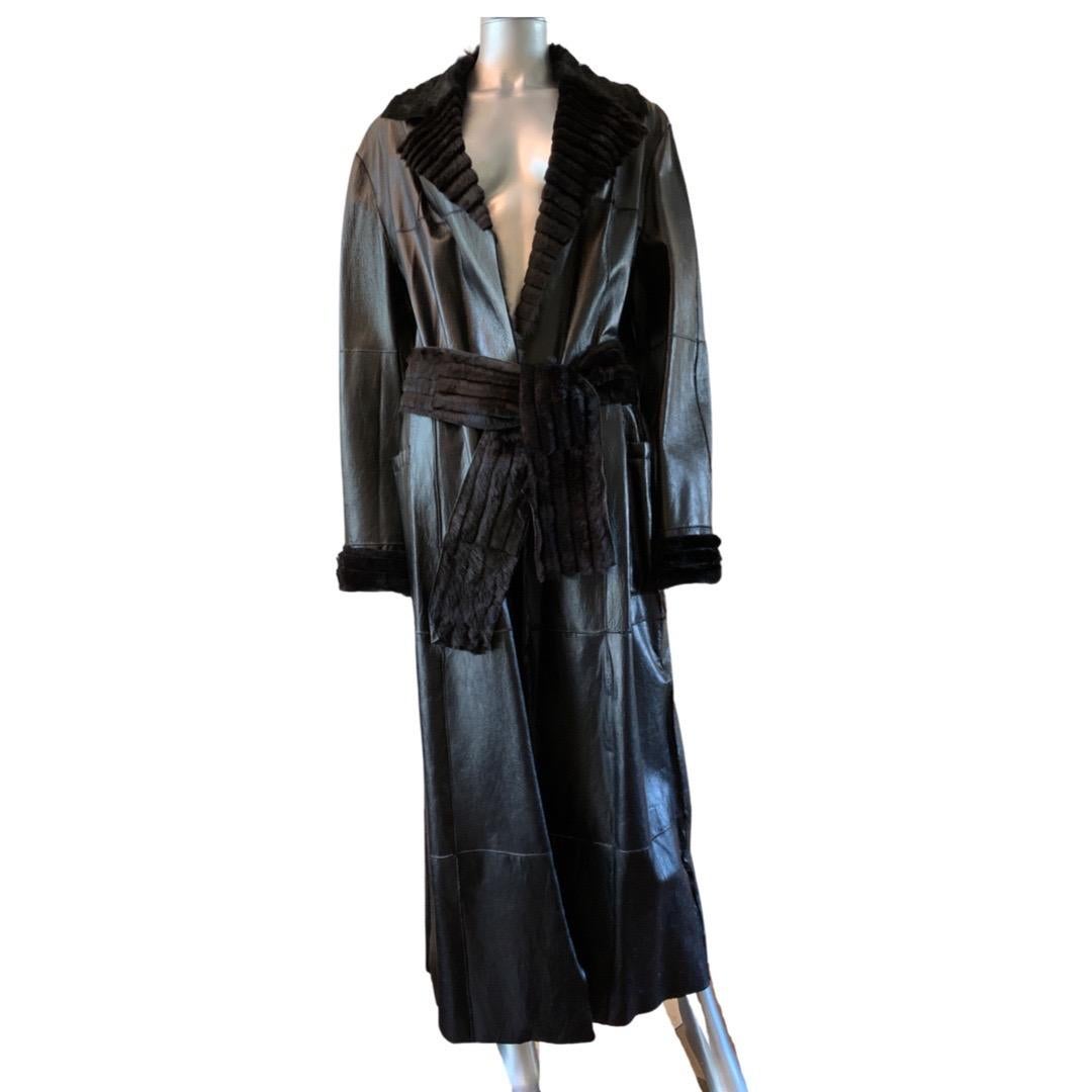 This coat designed by Mr. Ferre for the Gianfranco Ferre FORMA lable has been in a celebrity closet and never worn. Purchased at the Ferre boutique in Milan. IT is a gorgeous shiny black leather on the outside. Inside it is all sheared rabbit fur in