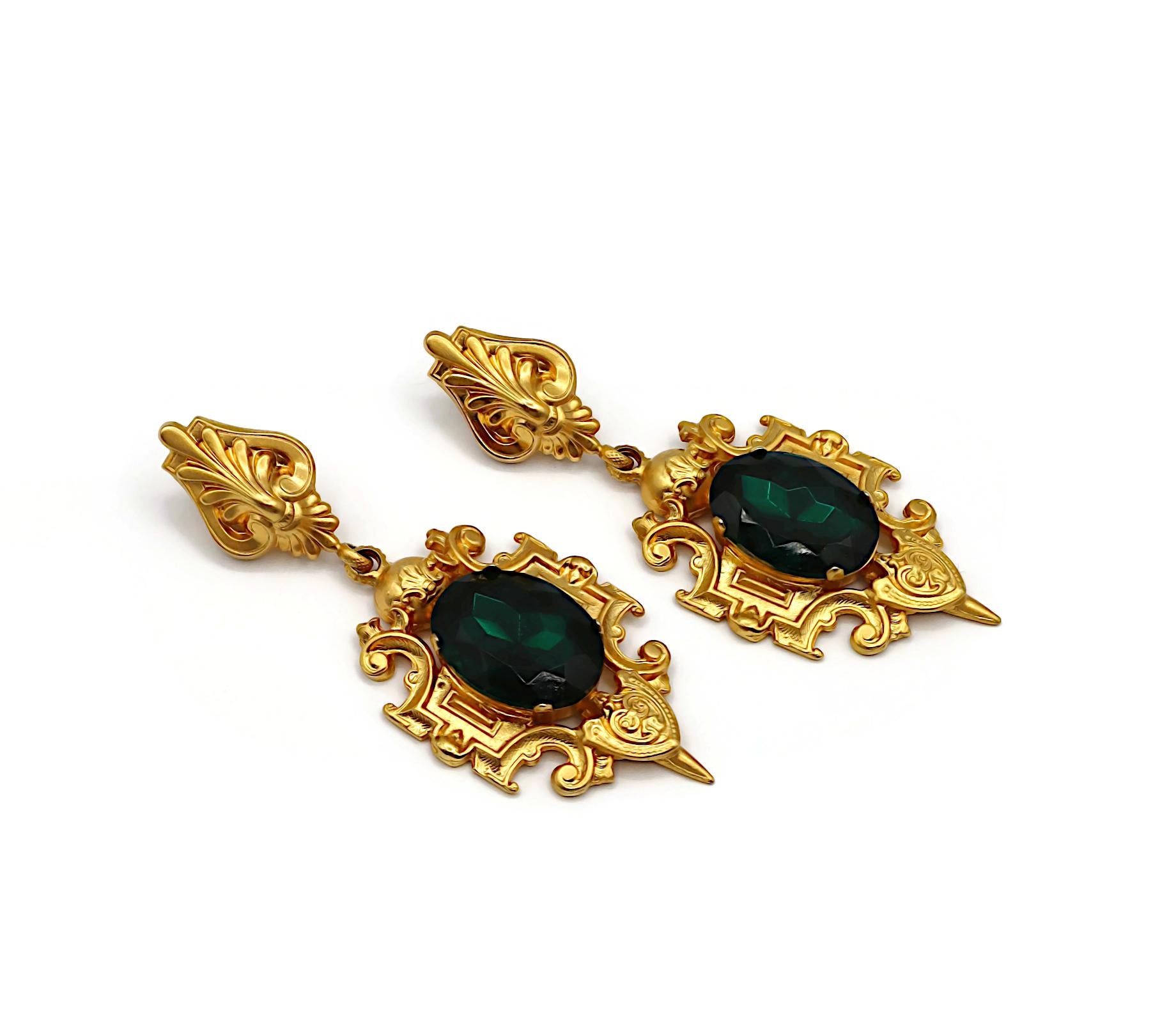 GIANFRANCO FERRE vintage massive gold tone dangle earrings (clip-on) embellished with a large oval green crystal.

Embossed FERRE Made in Italy.

Indicative measurements : height approx. 11 cm (4.33 inches) / max. width approx. 4.3 cm (1.69