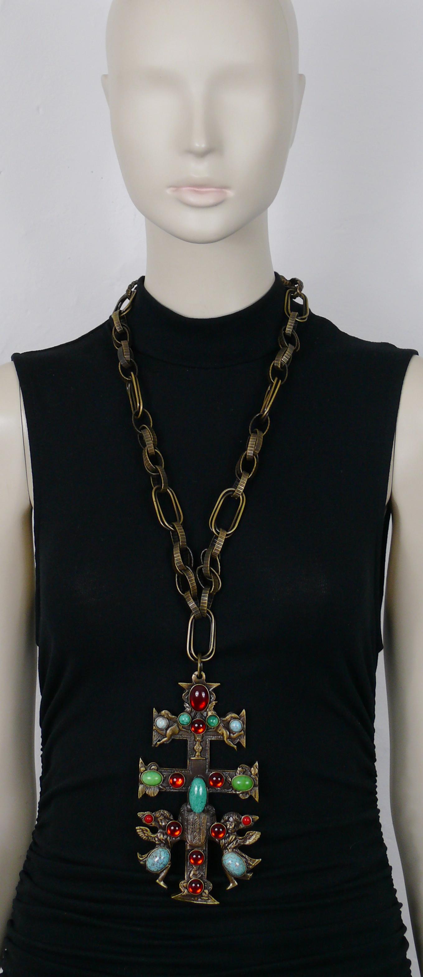GIANFRANCO FERRE vintage bronze tone chunky chain necklace featuring a massive Caravaca cross pendant embellished with angels and multicolored glass cabochons.

Hook clasp closure.

Embossed FERRE Made in Italy.

Indicative measurements : adjustable