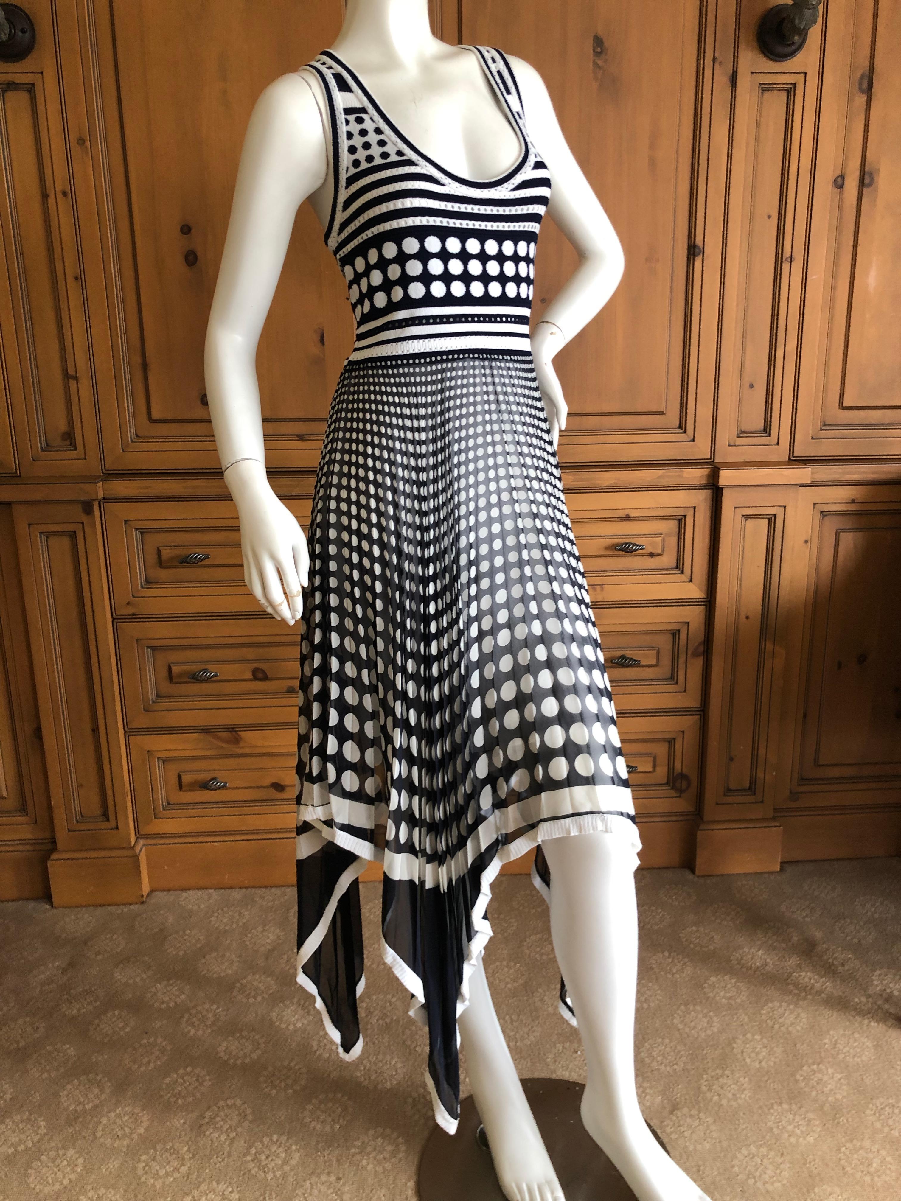 Gianfranco Ferre Vintage Op Art Polka Dot Dress with Pleated Asymmetrical Skirt.
The top is knit, and the skirt is sheer silk chiffon.
Size 44 (Vintage 44 is like today 38)
Bust 36