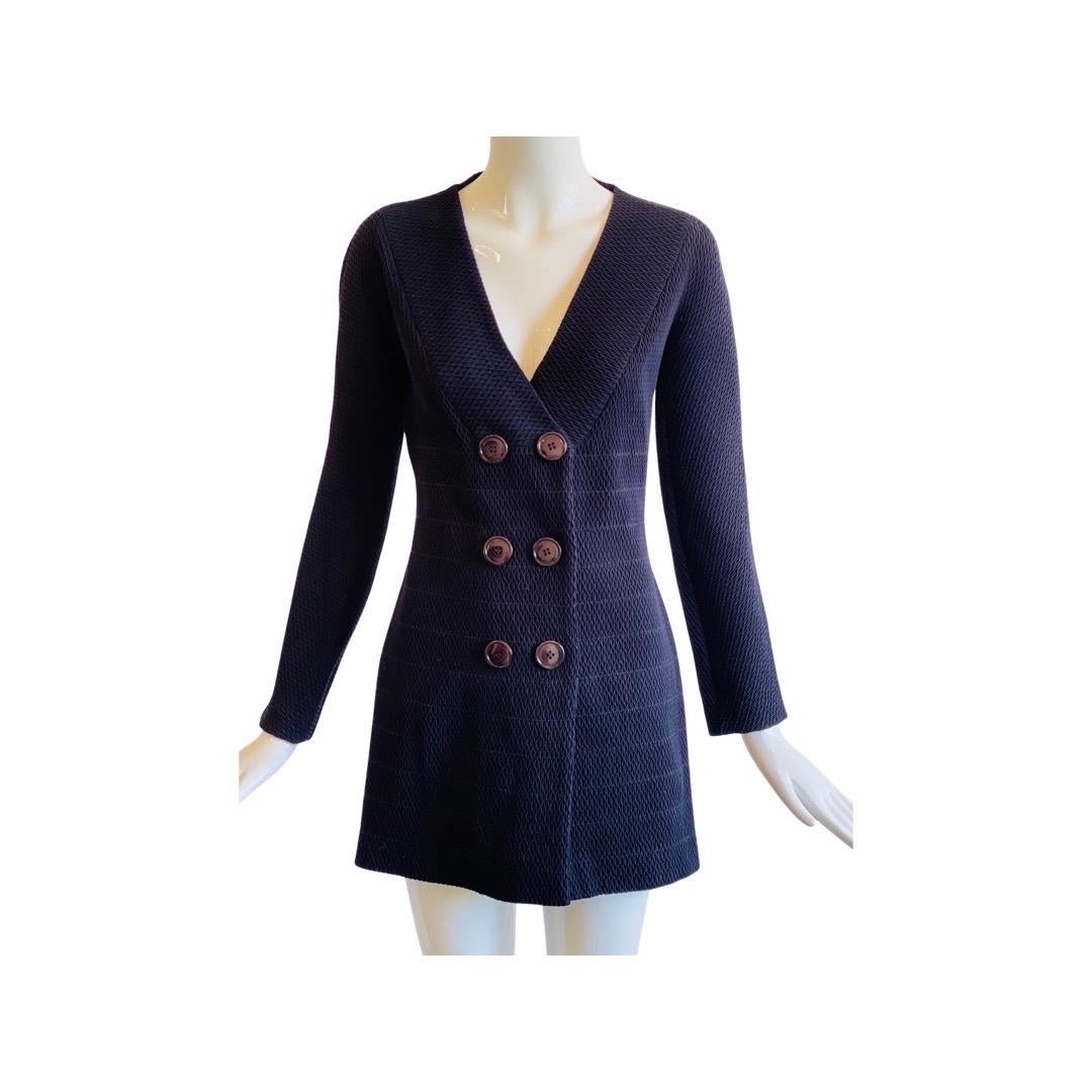 Stunning Gianfranco Ferre navy puckered suit. The entire fabric almost resembles smocking the way it looks. It’s a really incredible set, stretch to the fabric, all lined in silk, big buttons down the front. The skirt narrows at the waist, as does