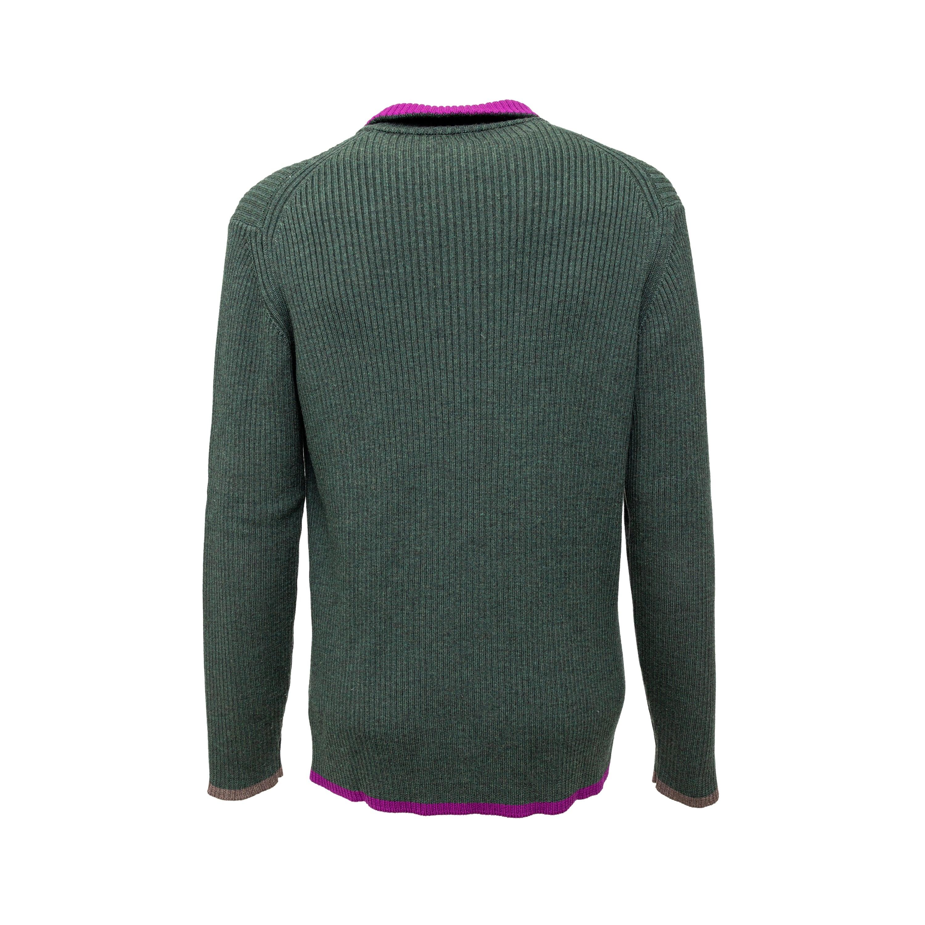 This Gianfranco Ferré Zippered Knit Sweater is made of luxurious merino wool, providing both warmth and softness. Its ribbed knit design adds texture to the moss green color, accented with a pop of fuchsia on the neck and hem. The brand's logo can