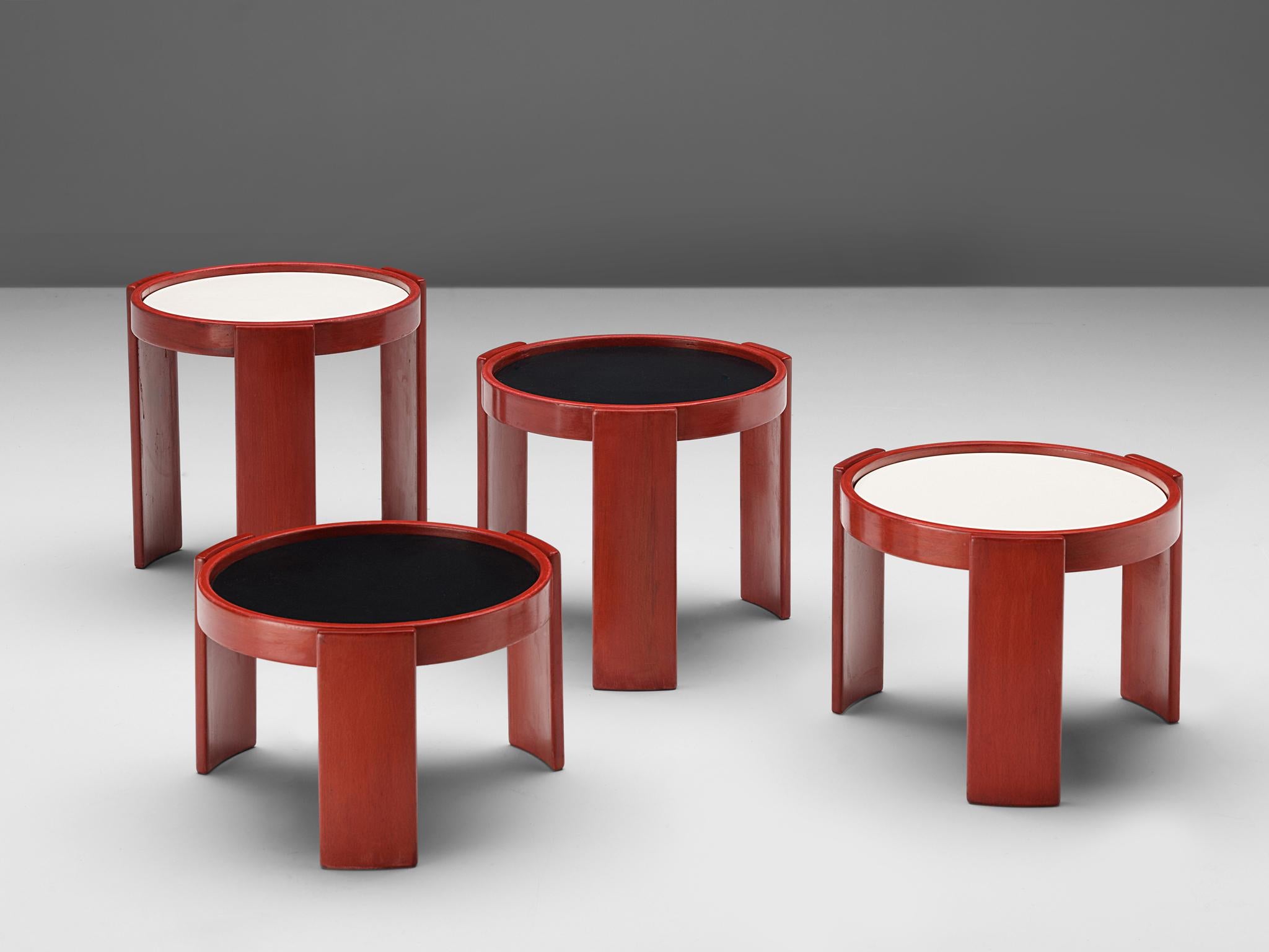 Gianfranco Frattini for Cassina, nesting table, red, black and white lacquered wood, Italy, 1960s.

Nesting tables consisting of four different pieces, designed by Gianfranco Frattini for Cassina. All the tables are, round shaped and of different
