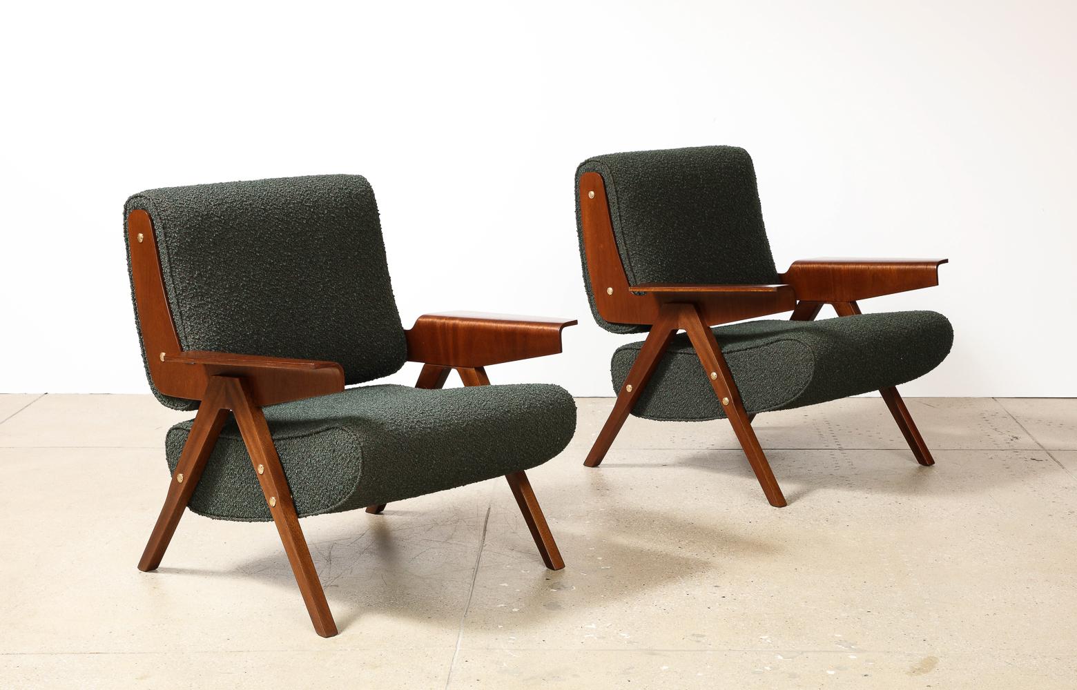 Rare pair of 831 lounge chairs by Gianfranco Frattini for Cassina. Bent plywood, mahogany veneer, fabric, brass. Graphic forms with brass mounts and deep green boucle fabric.