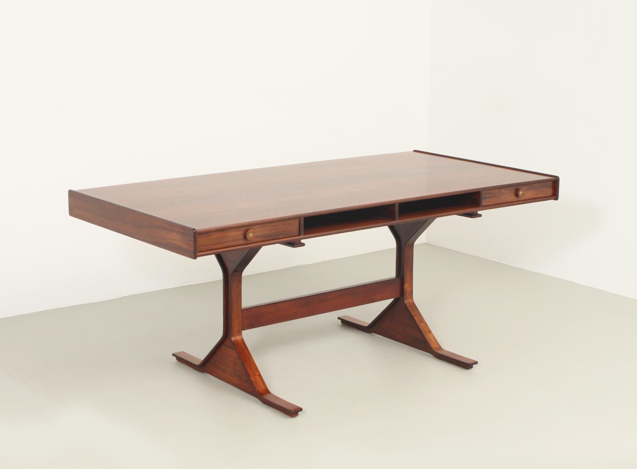 Desk designed by Gianfranco Frattini in 1956 for Bernini, Italy. Two drawers and two open spaces in the front side and another four open spaces in the back side. Signed with Bernini logo.