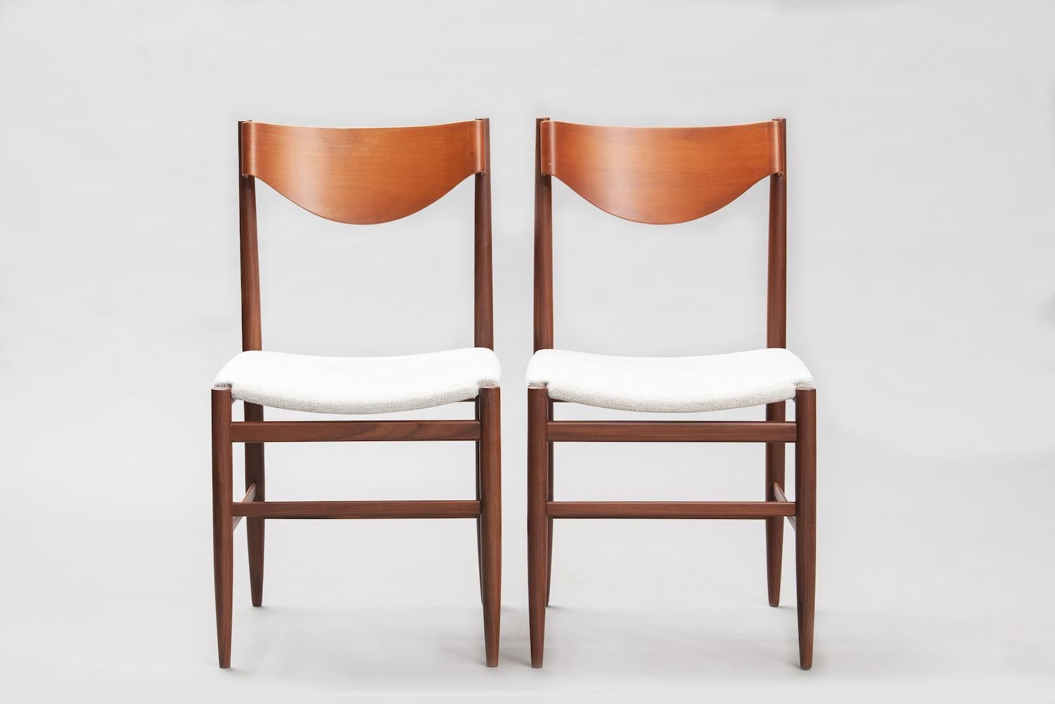 Set of six Gianfranco Frattini teak dining chairs re-upholstered in beige fabric.
 