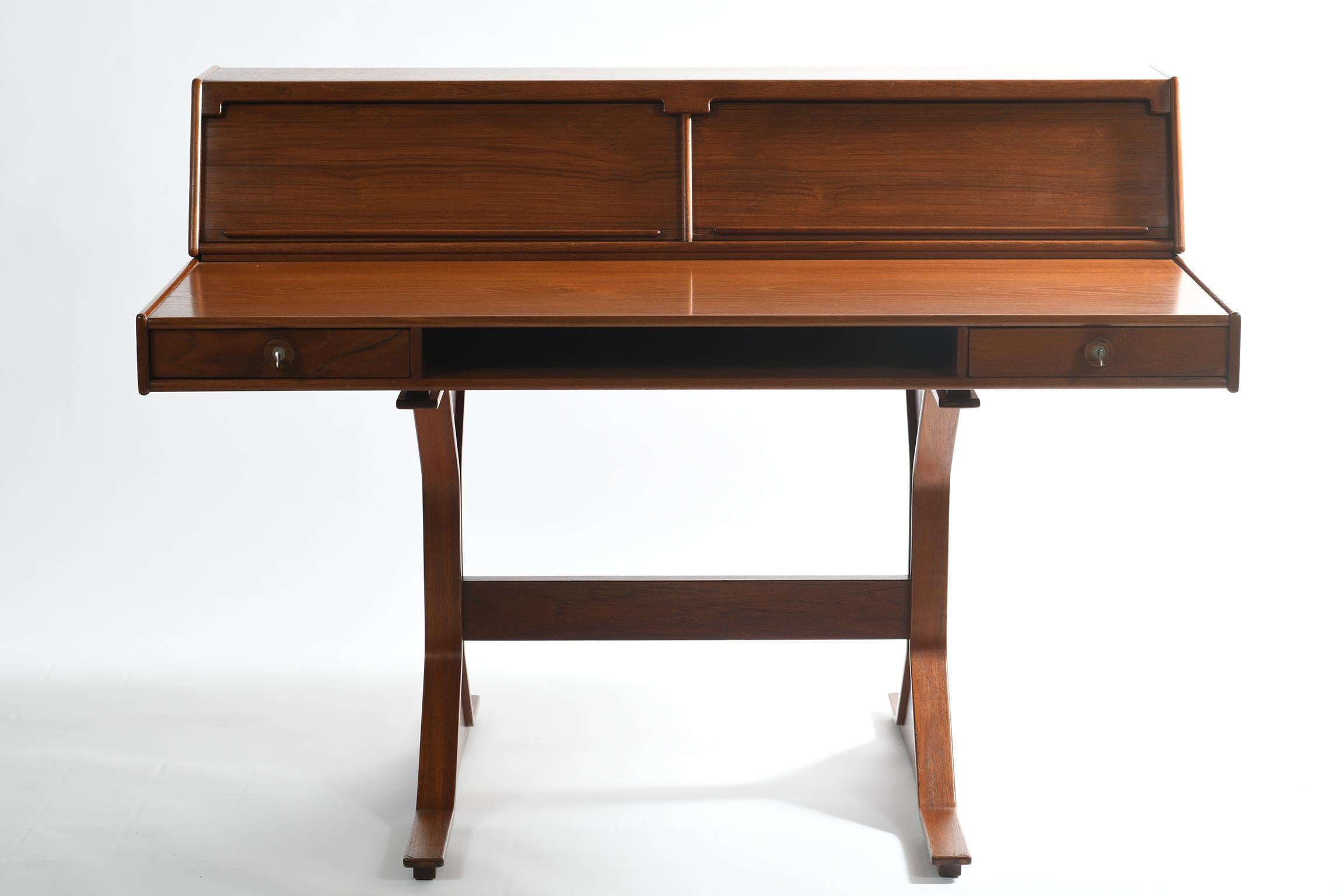 Iconic midcentury Italian writing desk designed by Gianfranco Frattini for Bernini in the 1957 model 530, the top writing section has two side drawers to the front, with key, and a central document shelf. On the top back sits a further section