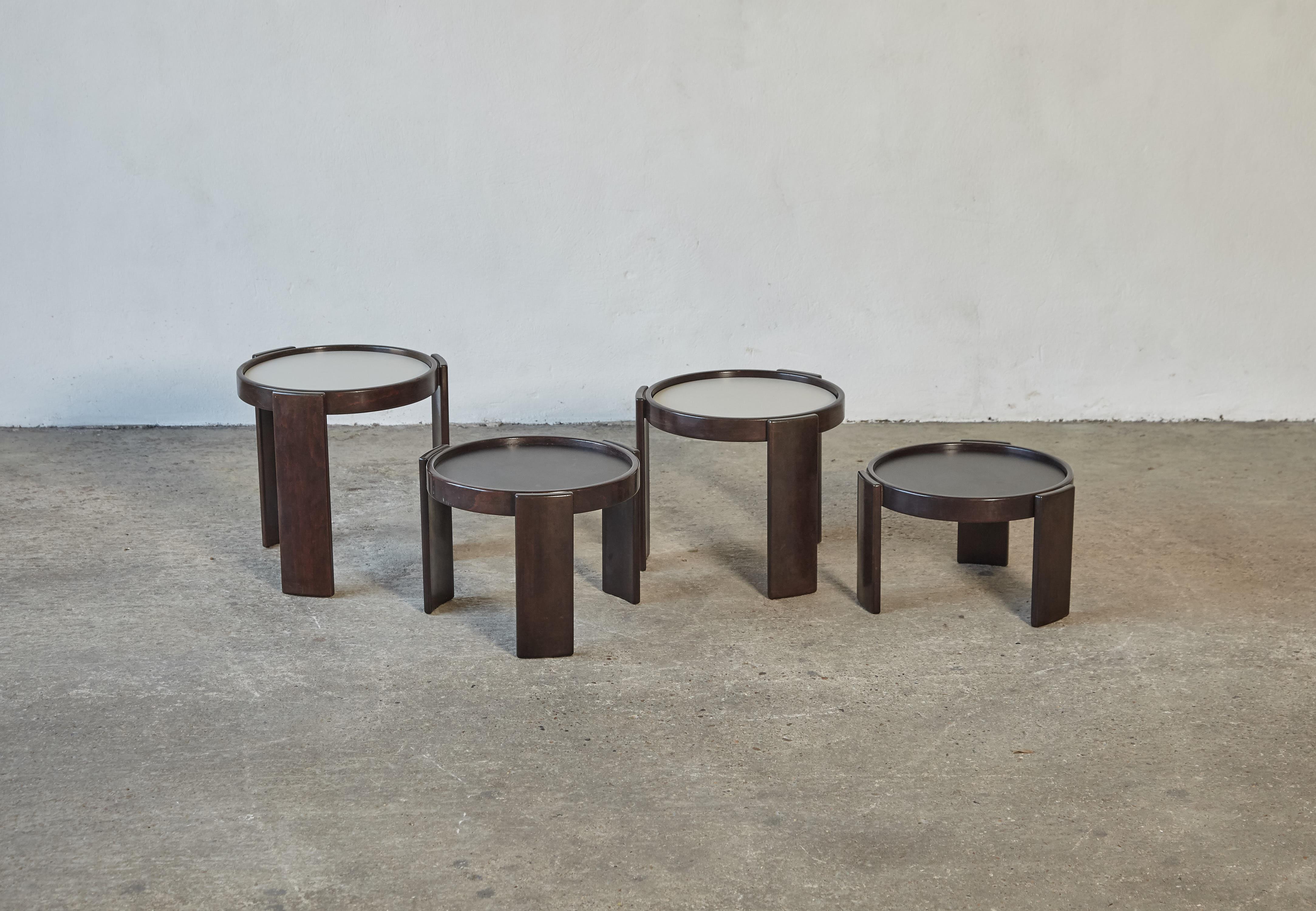 Gianfranco Frattini stacking nest of tables for Cassina, Italy, 1970s. Wooden frames and reversible laminate tops (reversible from black to white). With makers labels.   Fast shipping worldwide.


UK customers please note - displayed prices do not