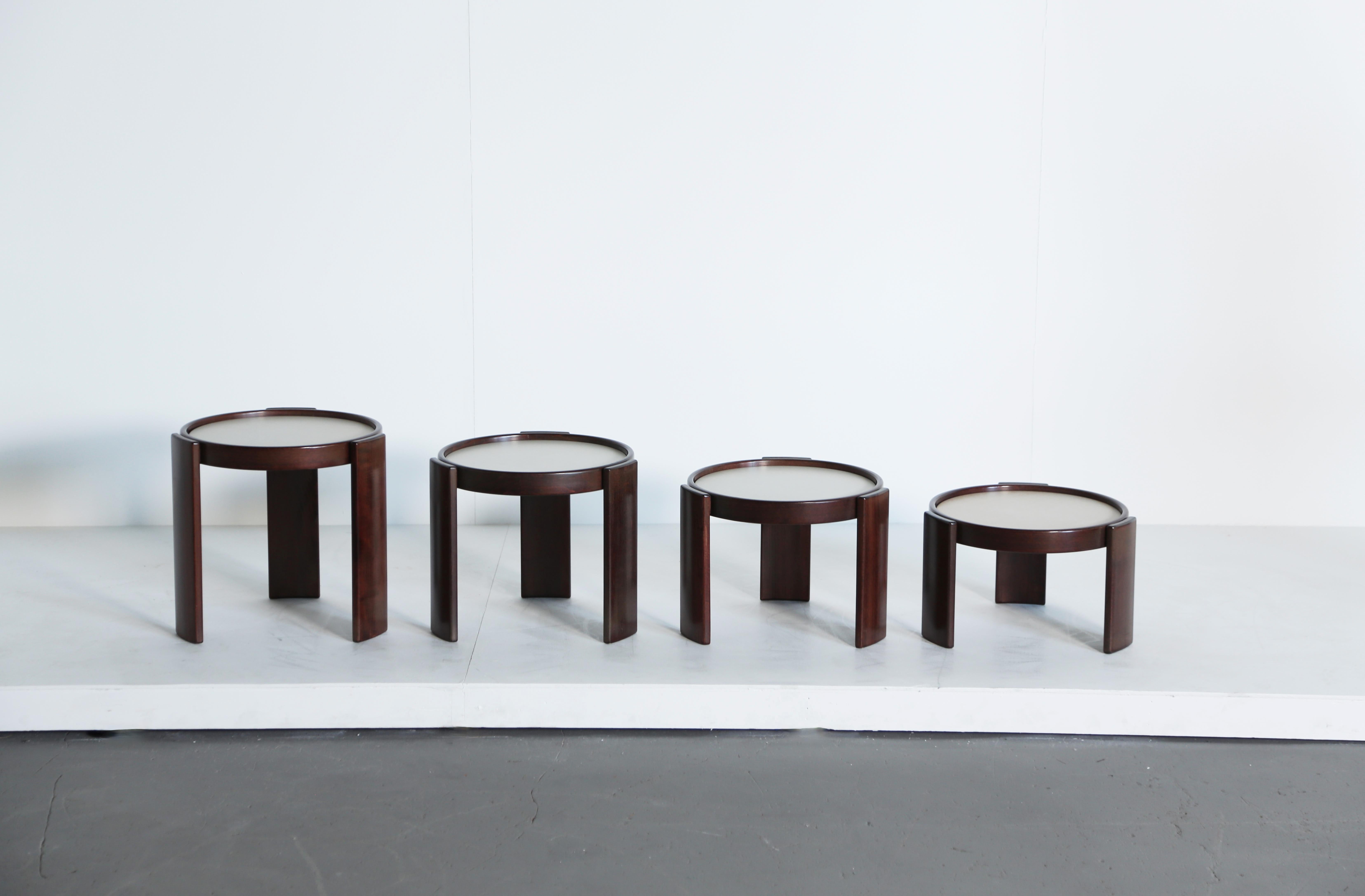 Gianfranco Frattini stacking nest of tables for Cassina, Italy, 1970s. Wooden frames and reversible laminate tops (reversible from black to white). With makers labels.  Fast shipping worldwide.

