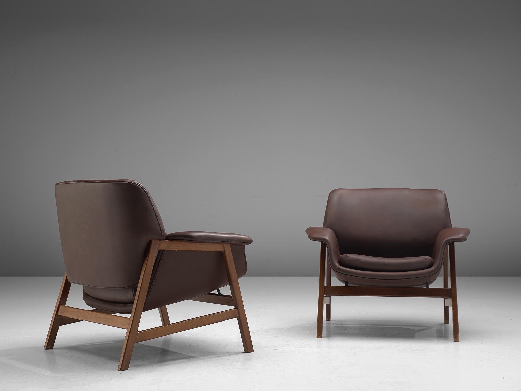 Gianfranco Frattini for Cassina, pair of customizable '849' easy chairs, walnut and leather, Italy, 1956

Wonderful pair of lounge chairs by Gianfrano Frattini for Cassina. This model features a walnut frame which holds the seat and backrest. A