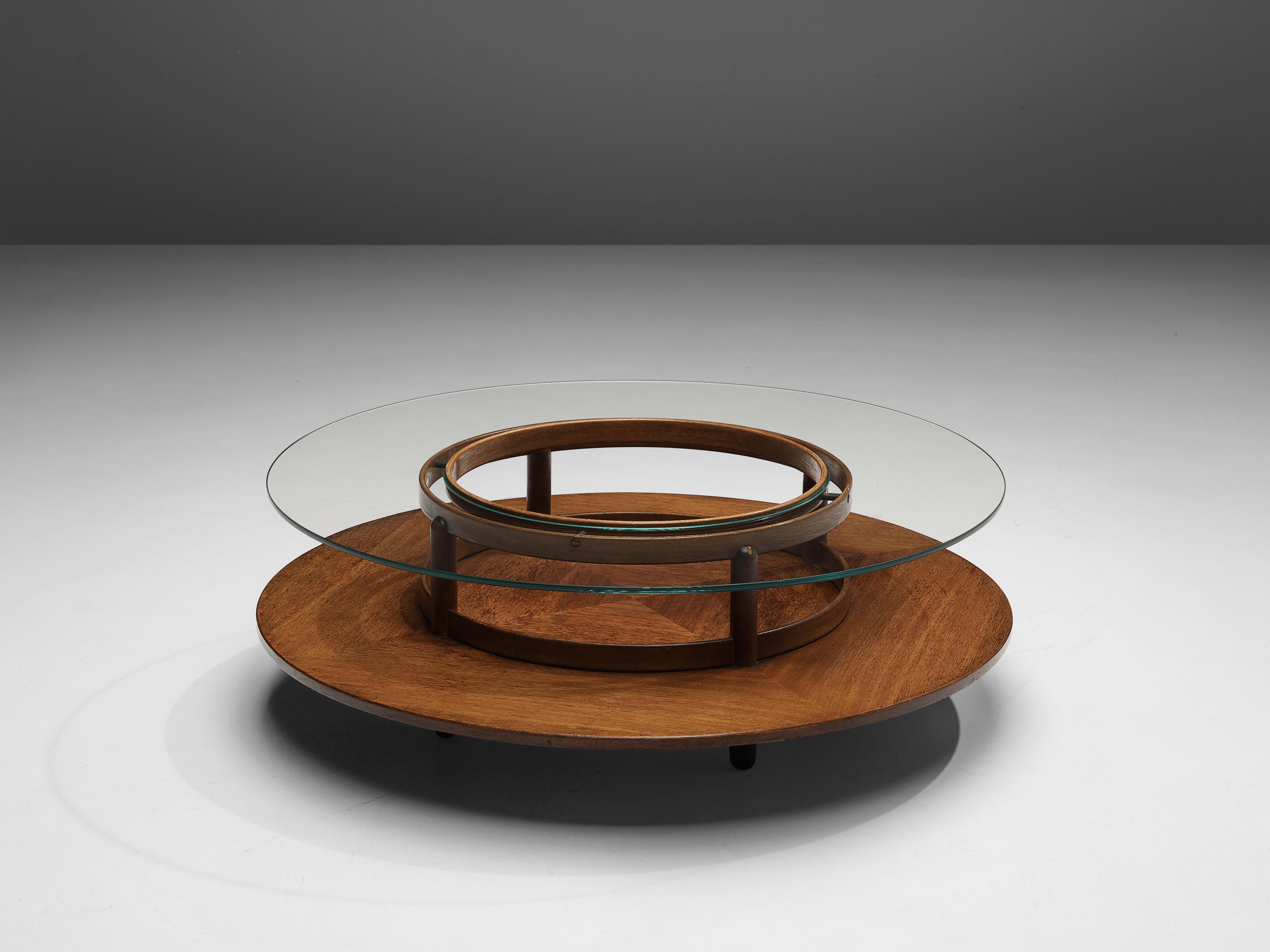 Gianfranco Frattini for Cassina, round coffee table, walnut, glass, Italy, 1950s

Beautiful coffee table in glass and walnut by Italian designer Gianfranco Frattini for Cassina. This table has an interesting design. A round top in glass exposes