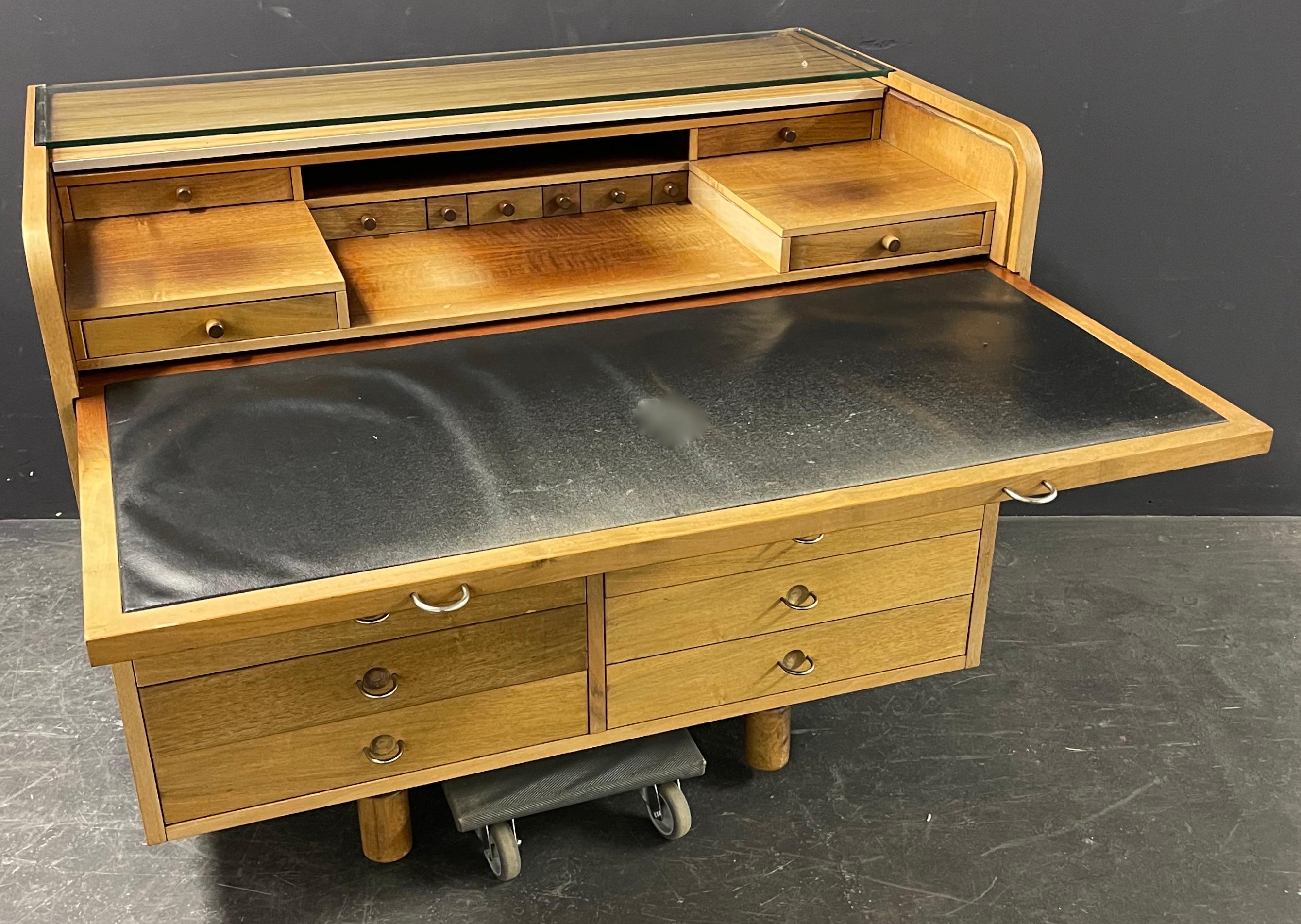 Walnut writing desk model 804 designed in 1961 by Gianfranco Frattini for Bernini, Italy. Tambour top that hides small drawers and a pull out leather writing surface. Front side with ten drawers and four open spaces on back side. Can be used as