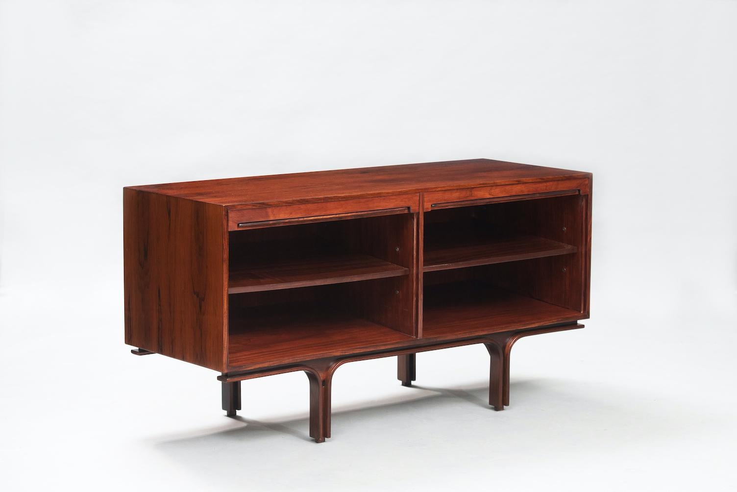 Gianfranco Frattini rosewood sideboard for Bernini with two tambour doors and shelving. It can be used as room divider because it has rosewood veneer in the back.