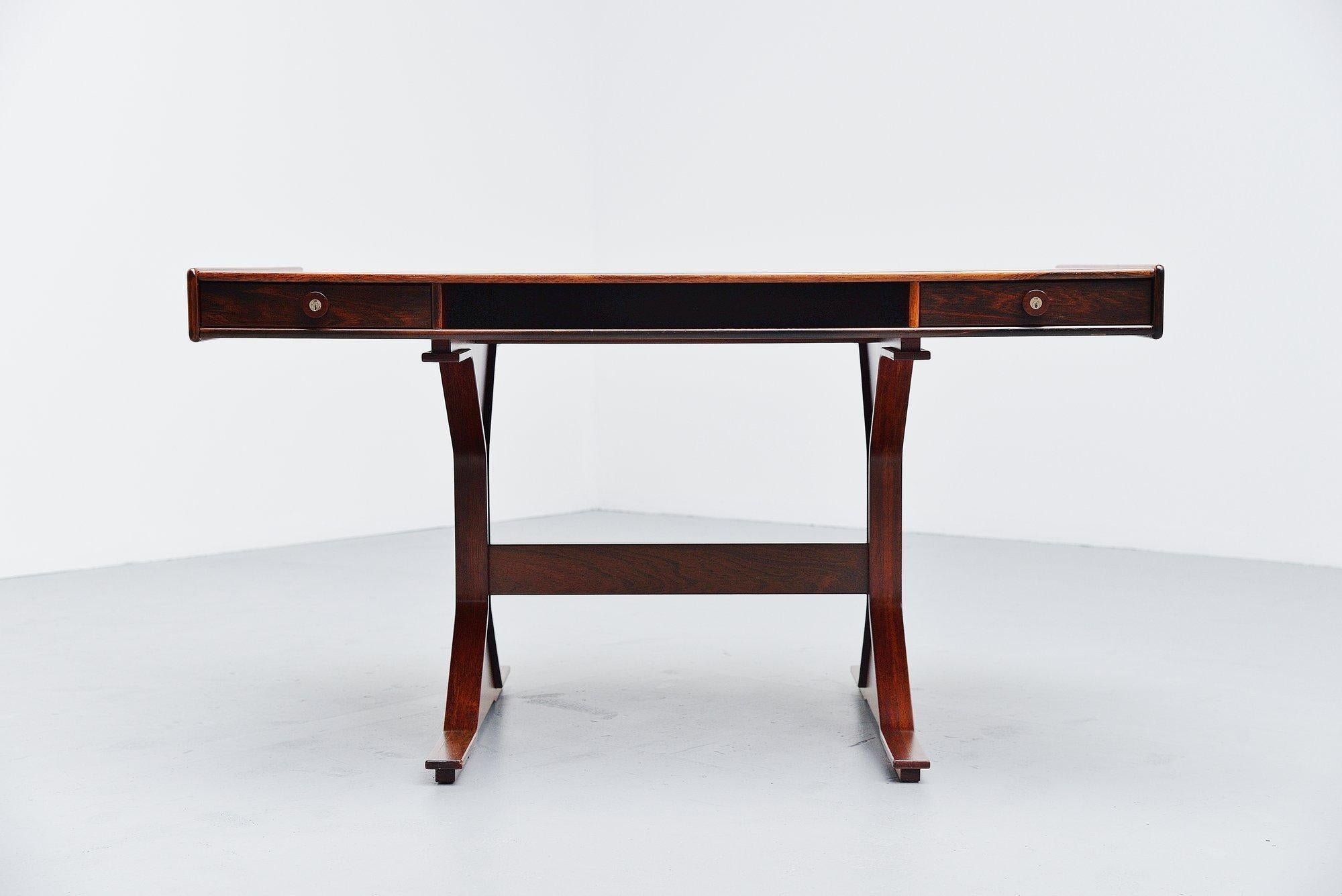 Fantastic Italian writing desk model 530 designed by Gianfranco Frattini and manufactured by Bernini, Italy 1957. This desk is made of nicely grained rosewood veneer and its looks very nice and slim. The lining of this desk is whats makes this desk