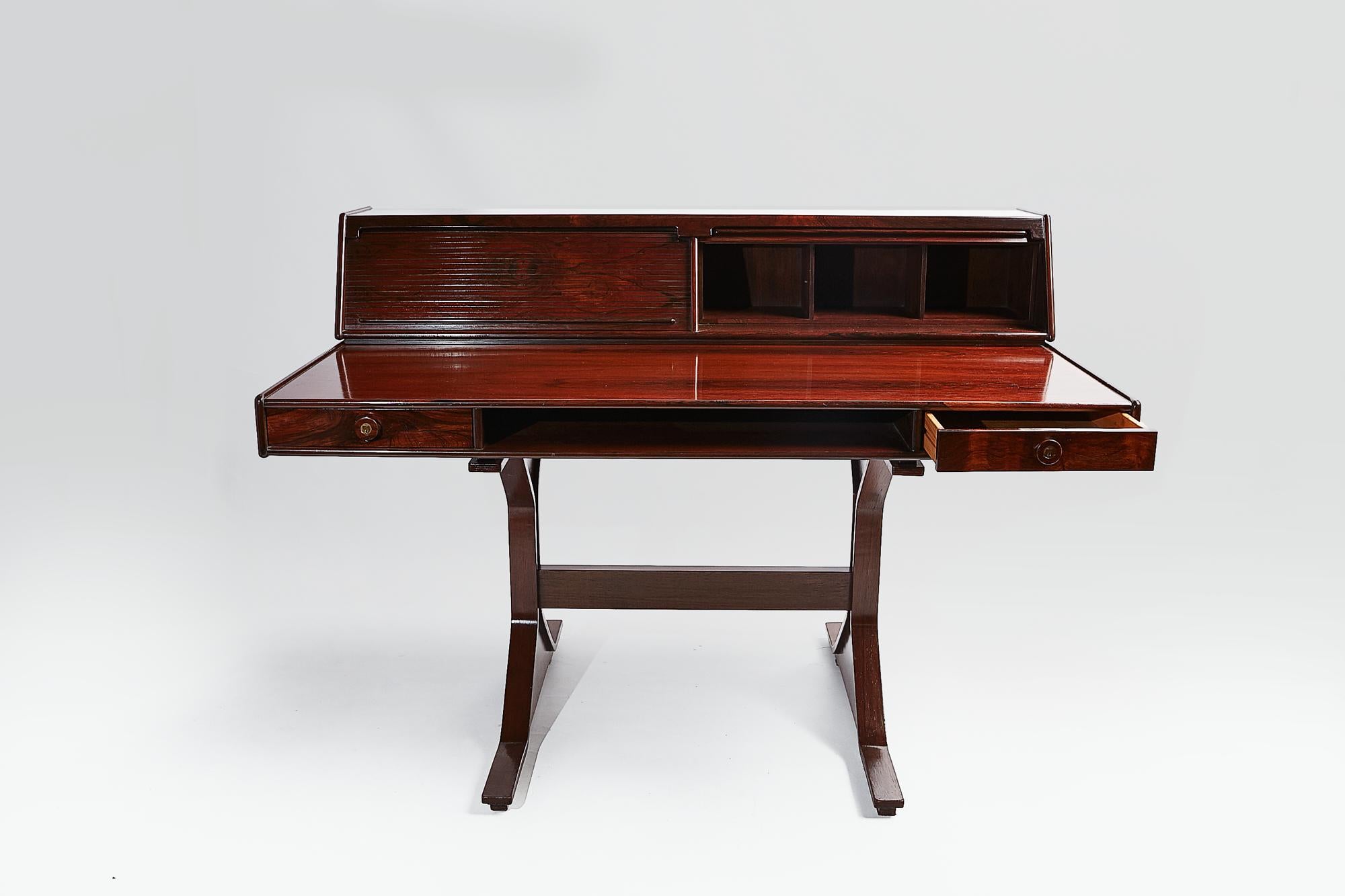 Superb Italian midcentury rosewood writing desk, Model 530, designed by architect and renowned furniture designer Gianfranco Frattini ( 1926-2004) and produced by Bernini, 1957. The top writing section has two side drawers to the front, with key,