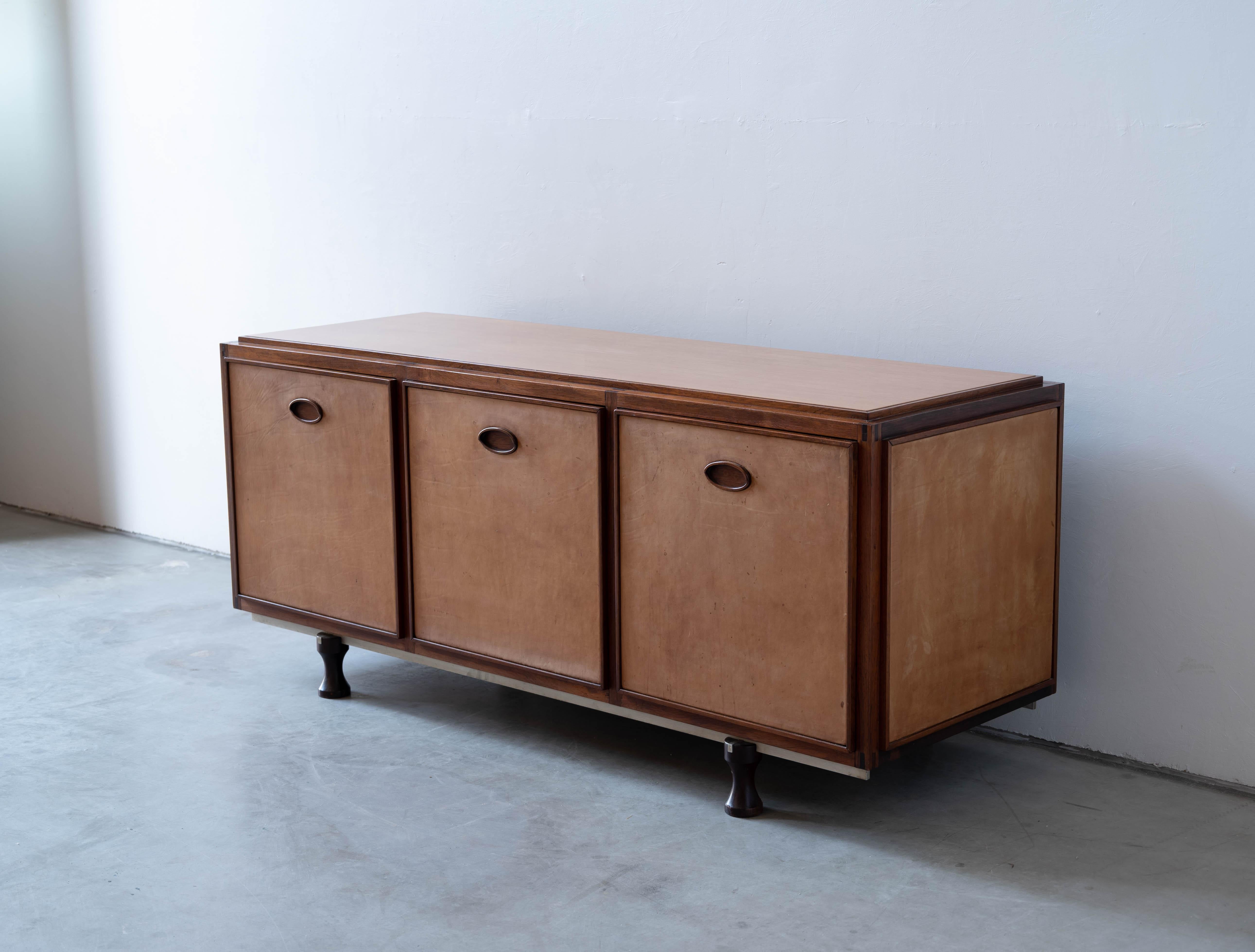 A sizeable and unique custom order cabinet / sideboard / credenza. Designed by Gianfranco Frattini and produced by Bernini, Italy, 1950s.

Features rosewood, leather and steel. All sides finished with leather, enabling the cabinet to be