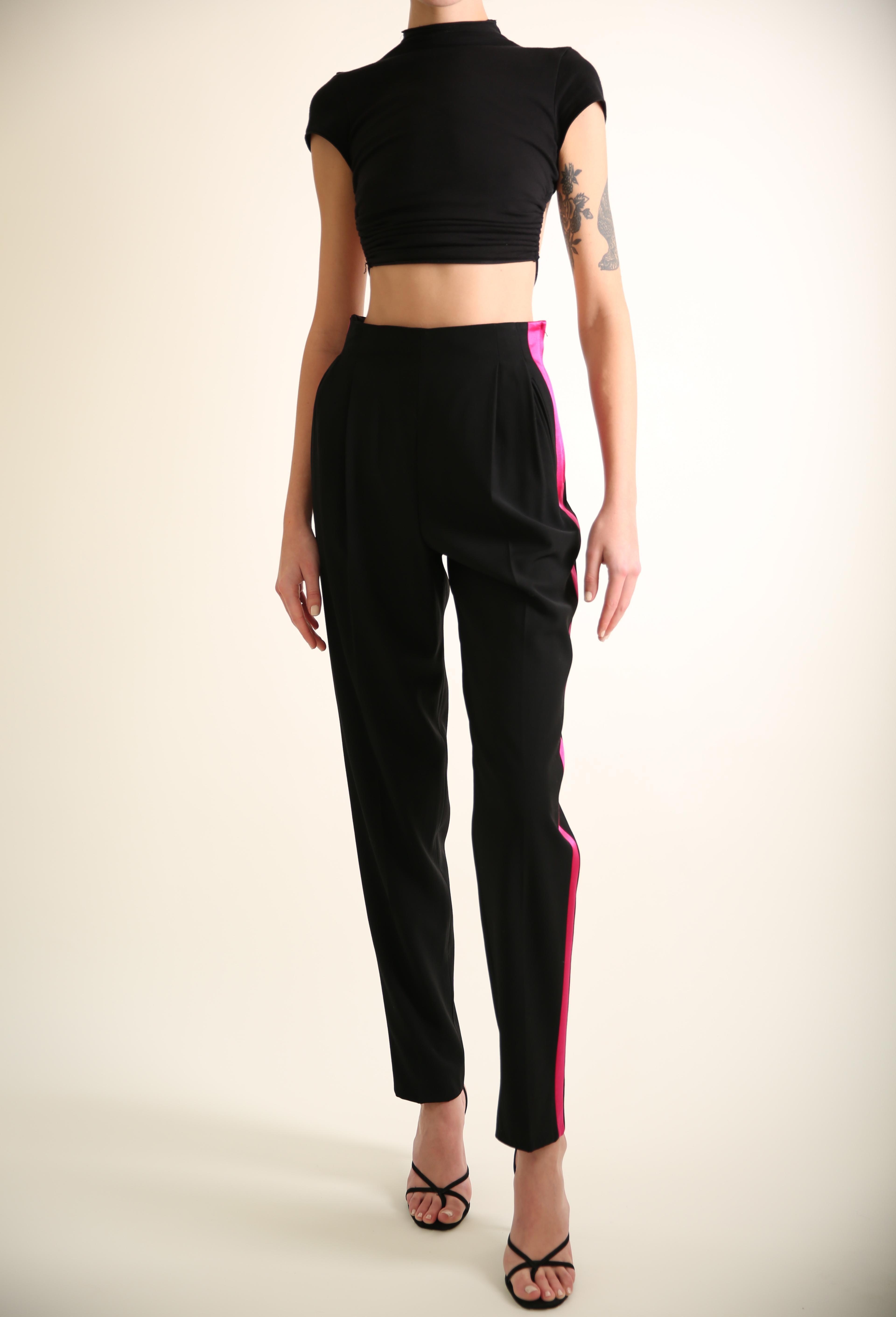 Gianfrano Ferre vintage high rise tapered pants
Black with a bright pink satin tuxedo stripe running down the side
Concealed side zip 
Pin-tuck pleats
Central crease
Two side pockets 


Composition:
100% wool

Size:
IT 40

In excellent condition