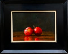 Still life painting of two red fruits by the best Italian realist painter
