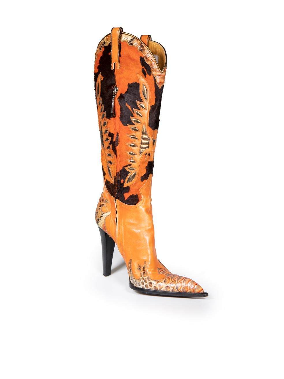 CONDITION is Good. Minor wear to boots is evident. Light abrasions to the leather and some peeling to the python leather on this used Gianmarco Lorenzi designer resale item.
 
 
 
 Details
 
 
 Orange
 
 Pony hair
 
 Cowboy boots
 
 Python and