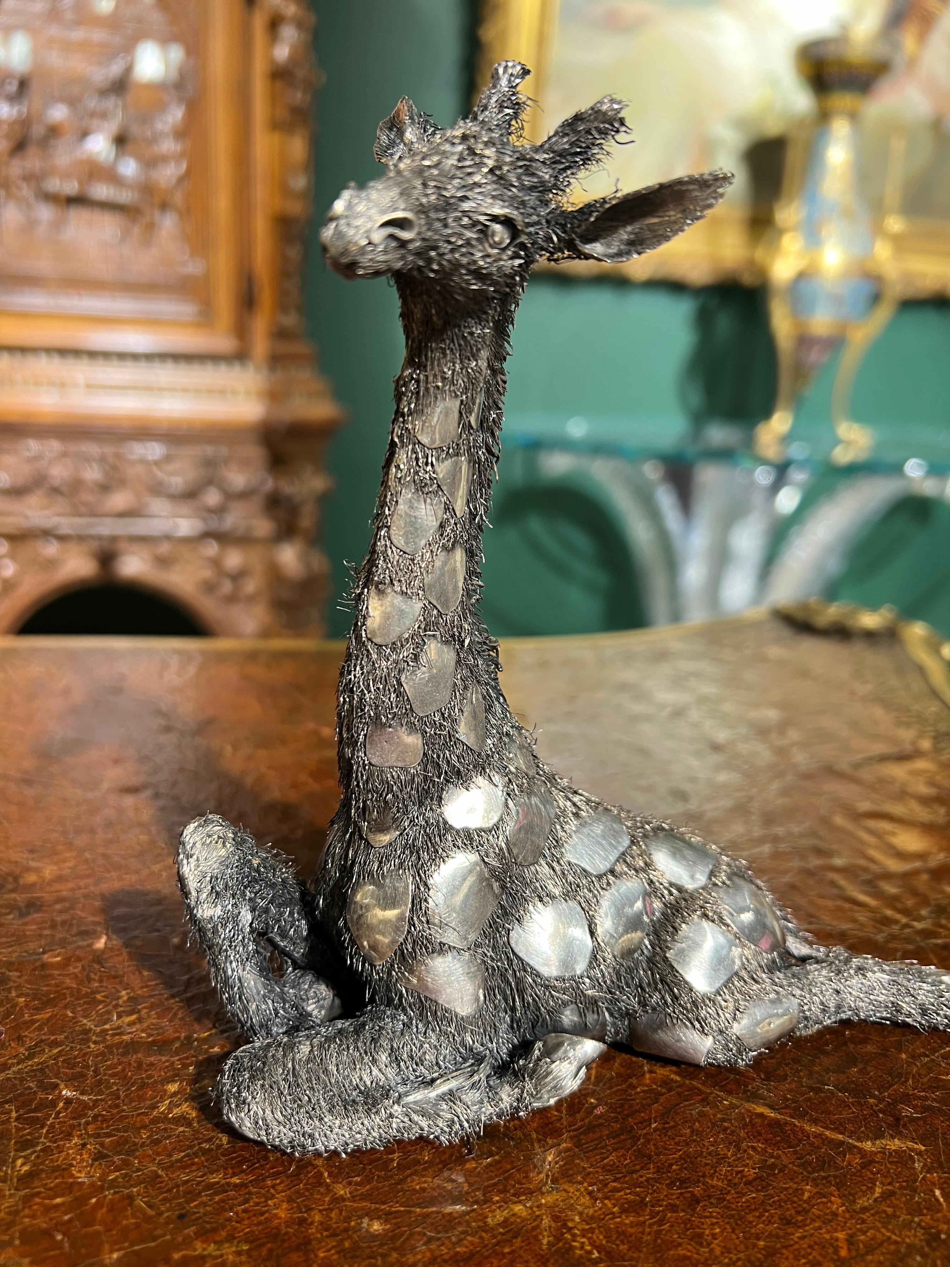 Gianmaria Buccellati, An Italian Silver Furry Model of A Giraffe.

A captivating piece of art from the 20th century, crafted with meticulous attention to detail, this exquisite sculpture captures the grace and elegance of one of nature's most