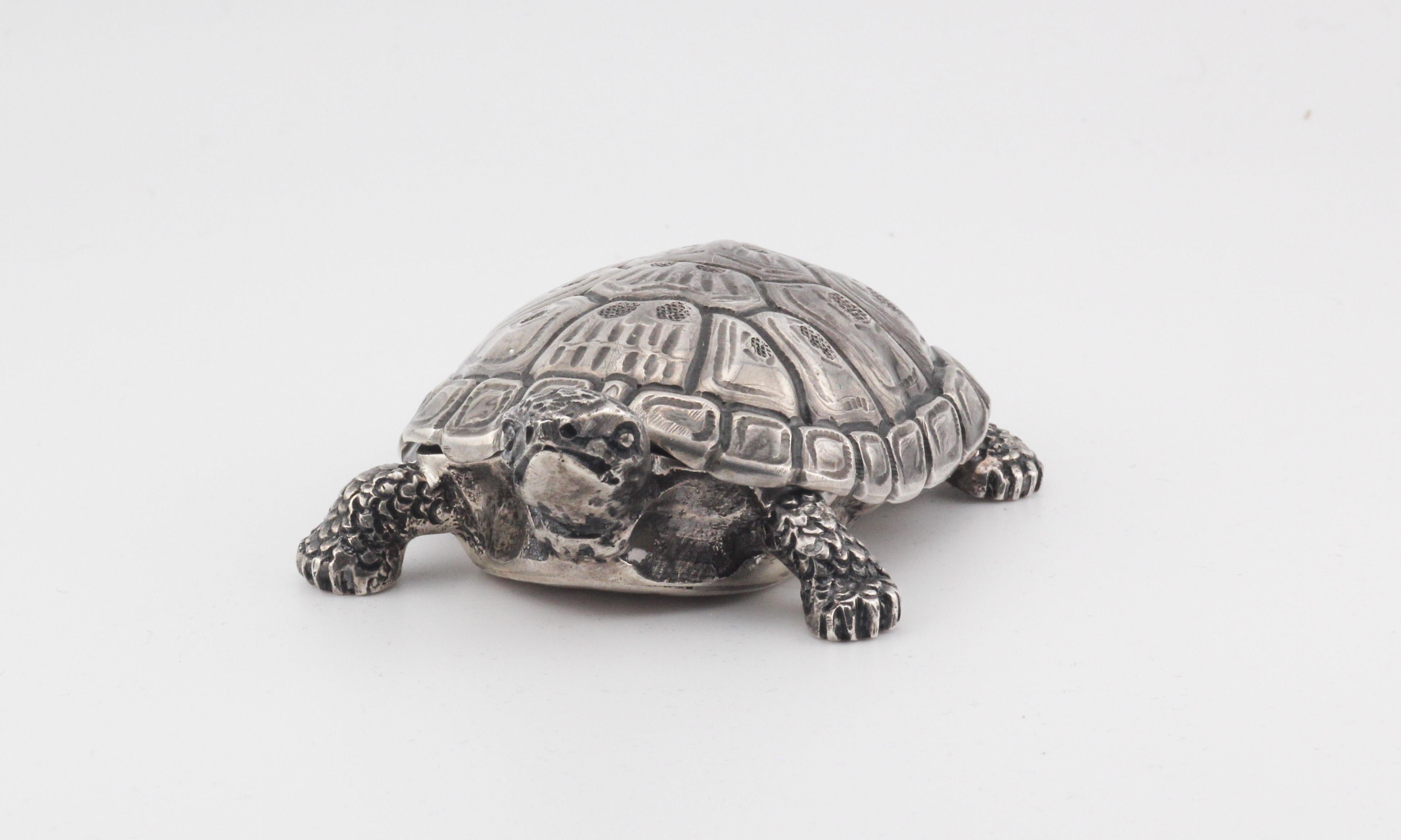 The Gianmaria Buccellati Sterling Silver Turtle Box is a remarkable fusion of artistic brilliance and masterful craftsmanship, meticulously crafted to capture the essence of nature's grace. This exquisite objet d'art serves not only as a functional