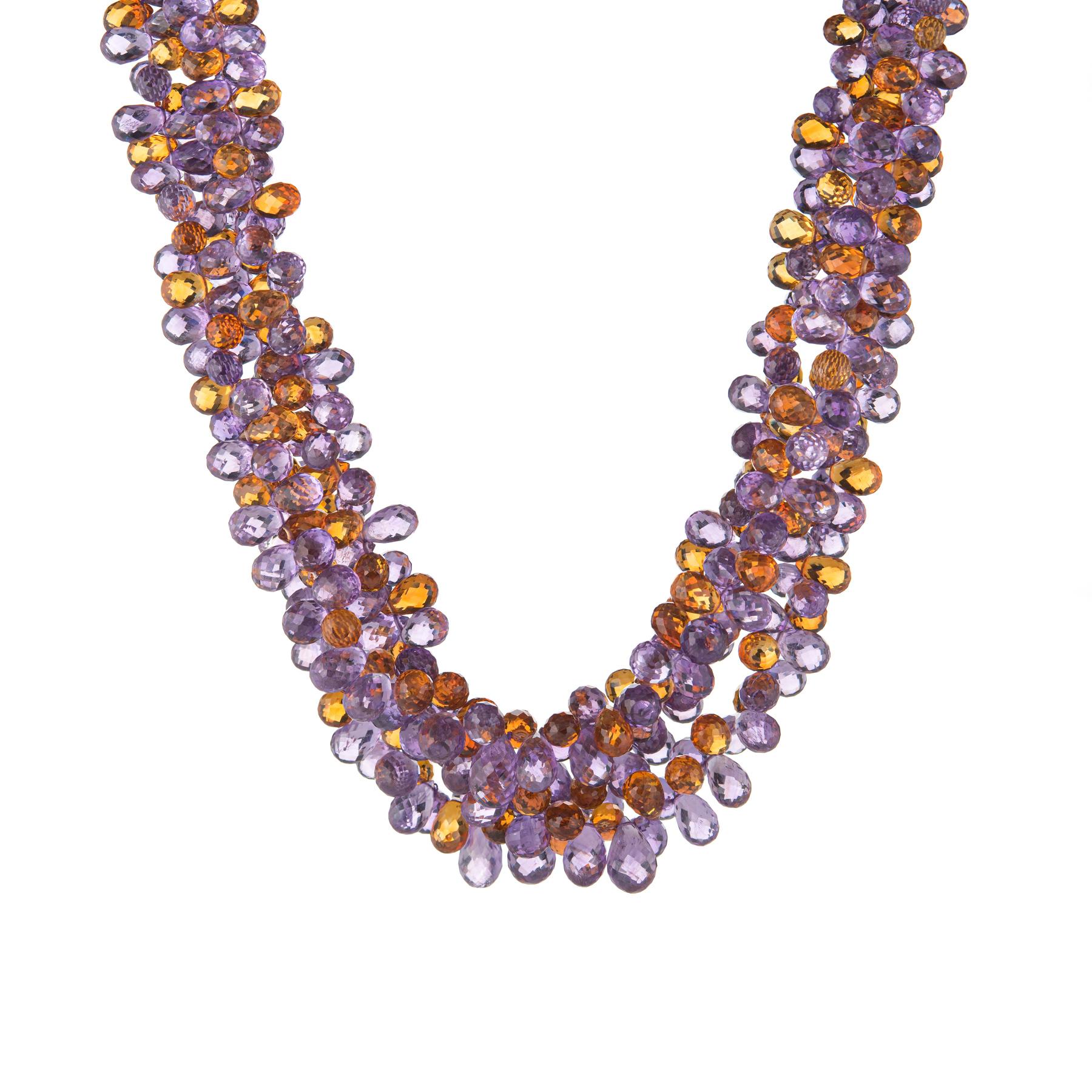 Elegant and finely detailed Buccellati torsade necklace, finished with a 18 karat yellow gold clasp.  

Three strands of briolette faceted citrine and amethyst measure (average) 5mm. The semi-precious gemstones are in excellent condition and free of