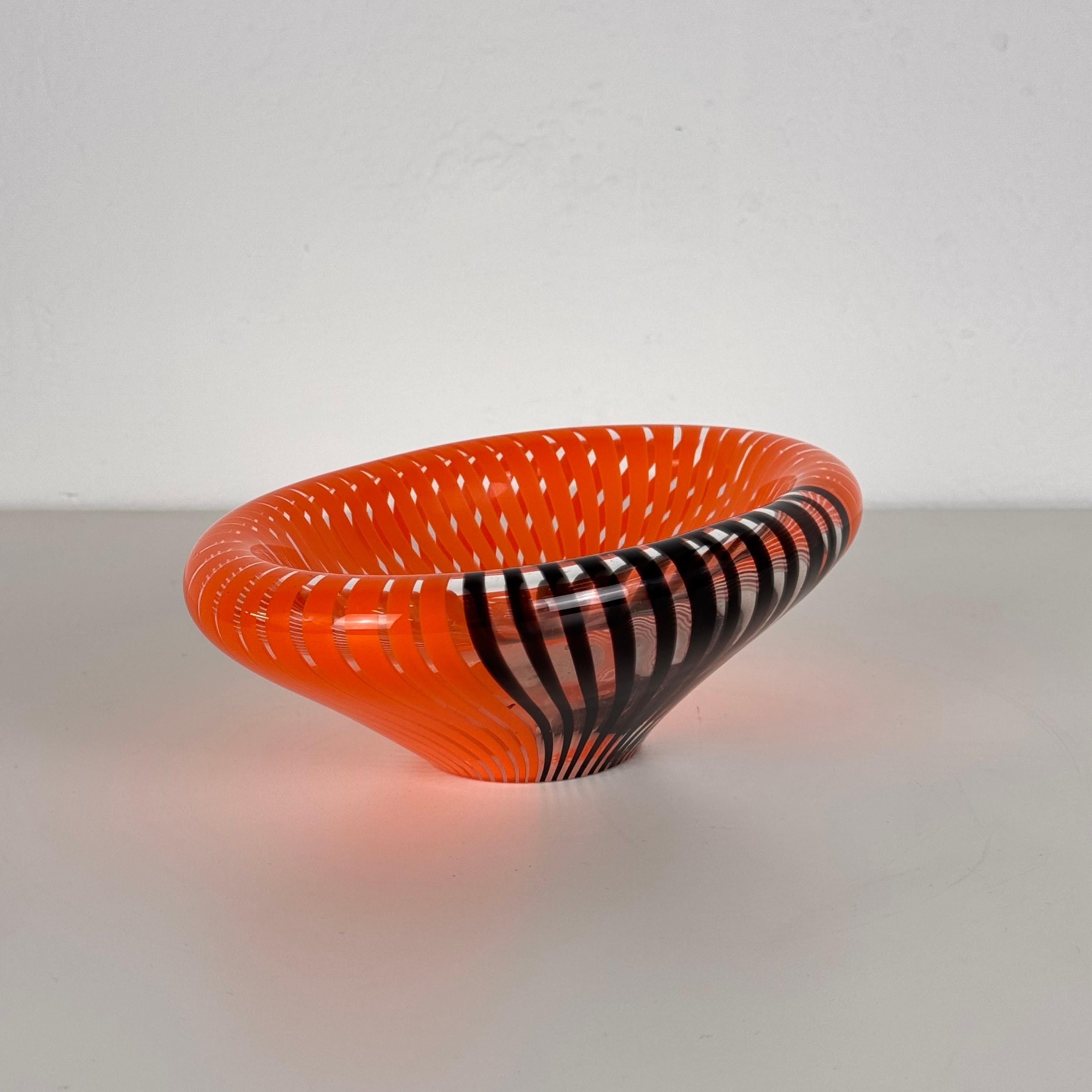 
A striking Murano glass catch-all/centerpiece designed by Gian Maria Potenza for La Murrina in the 1970s. This exceptional piece seamlessly combines vibrant orange, deep black, and clear glass, hallmark elements of Potenza's bold and innovative