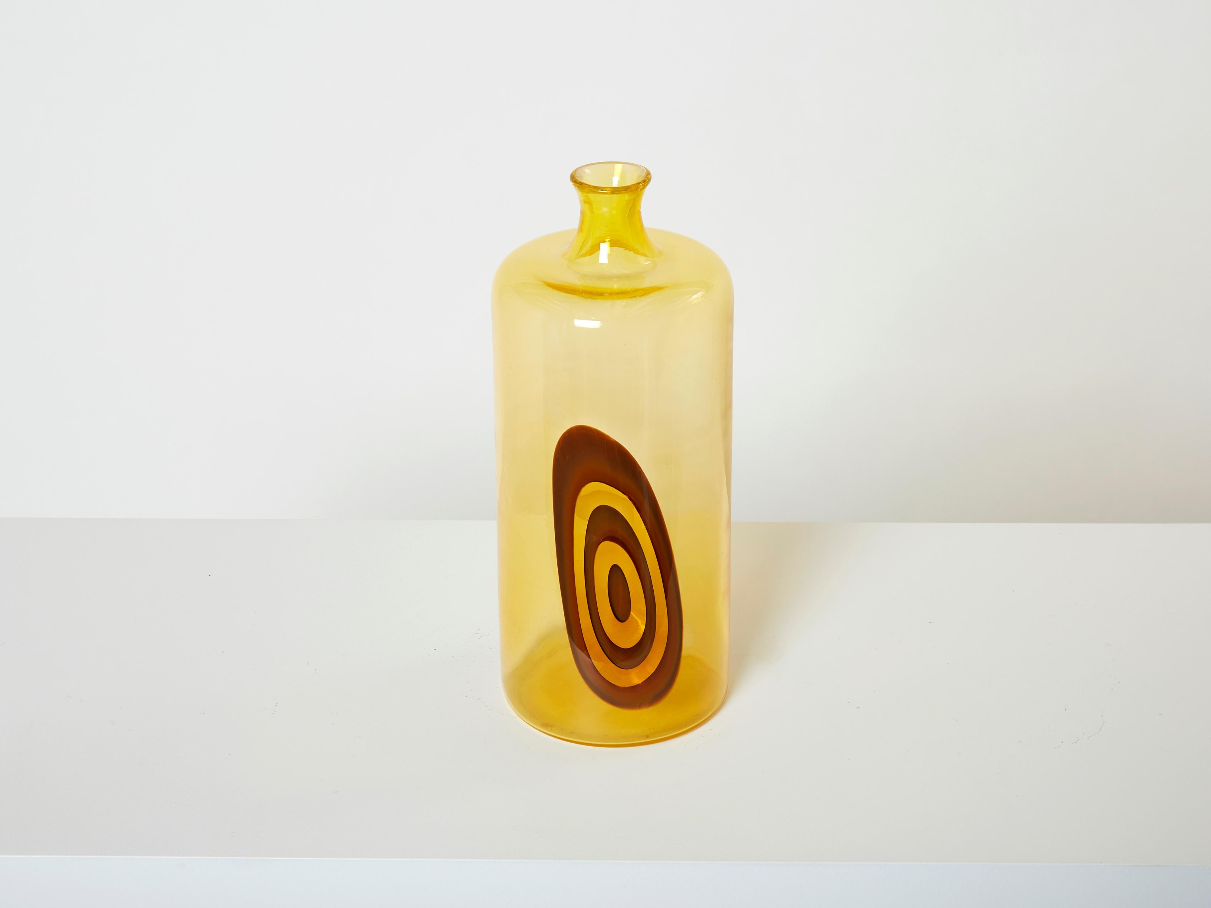 Rare Gianmaria Potenza vase for La Murrina made in 1968 from the Saturno series. This vase has eye-catching colors, with concentric orange circles on an amber background, submerged yellow Murano glass. It is very large and tall, bottle shaped with a