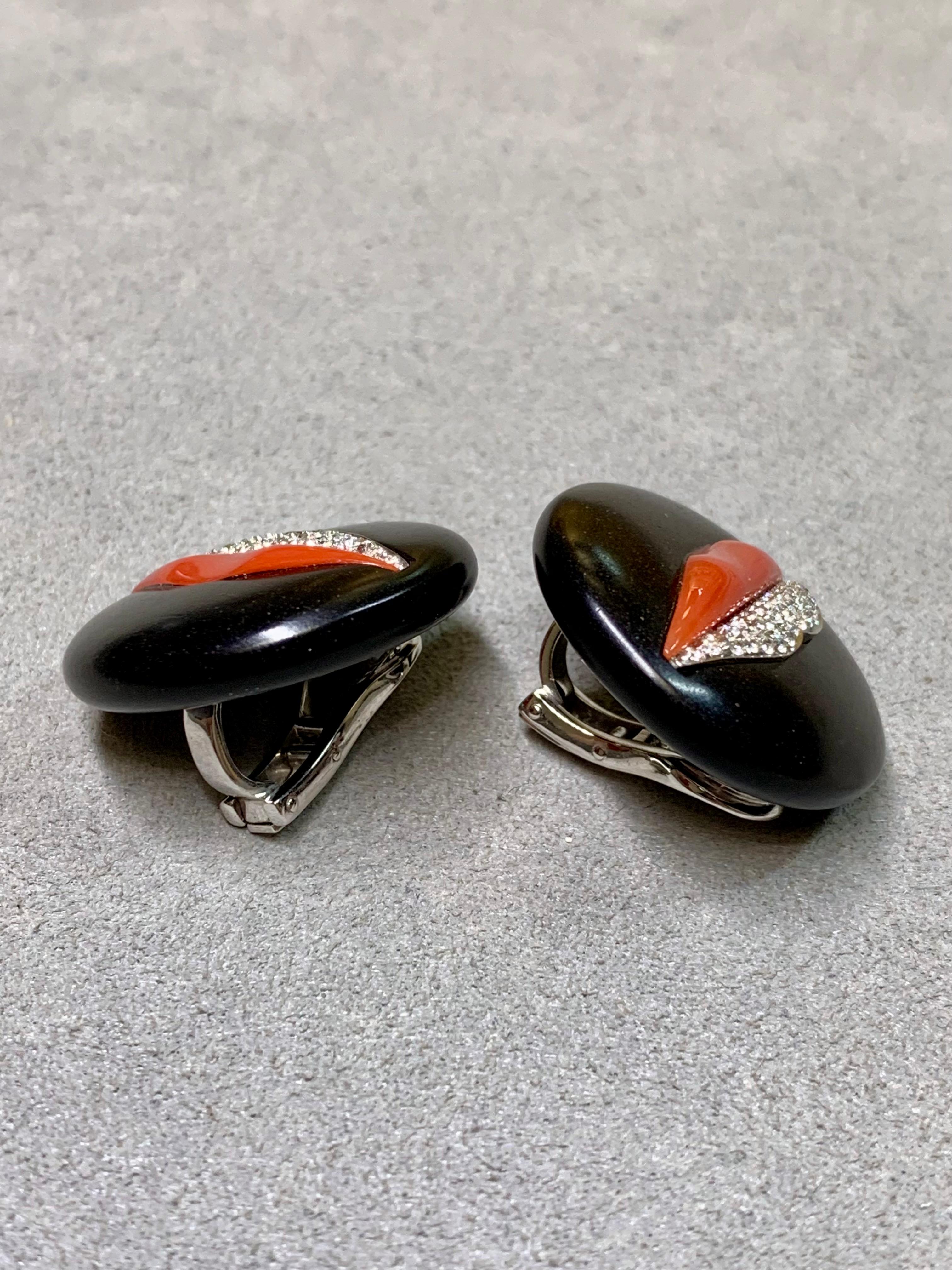 Incredibly bold jewelry by designer Gianni Bulgari. A light and wearable pair of earrings done in jet and coral and finished in 18K white gold and diamonds. An iconic design from a very desirable maker.


Dimensions/Weight:

Earrings measure 25mm in