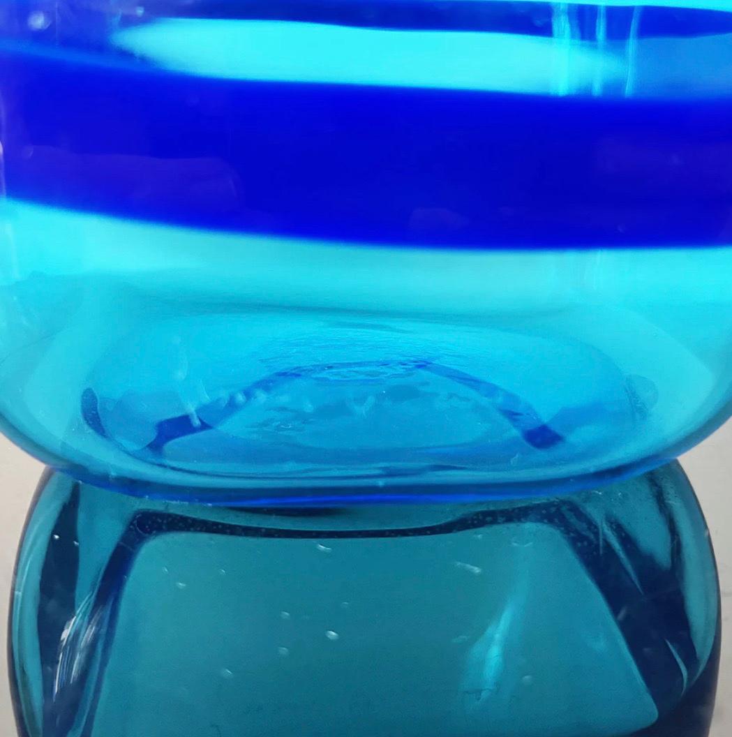 blue round liquor bottle